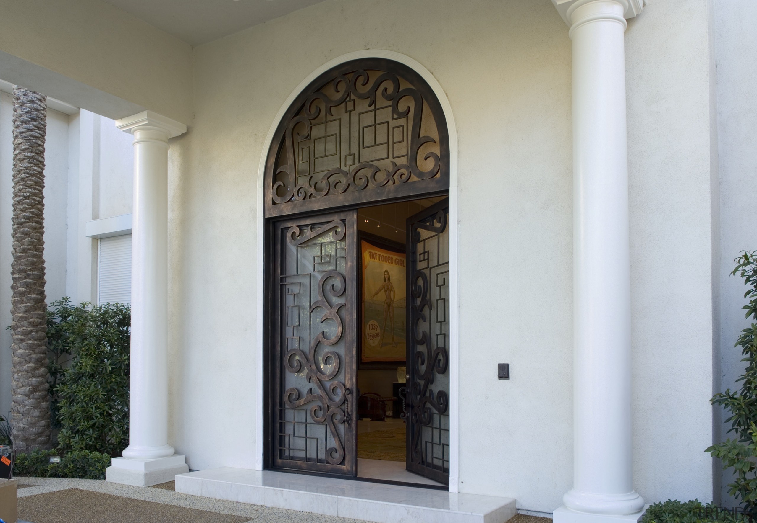 A view of the custome designed doors in arch, column, door, estate, facade, structure, window, white, gray