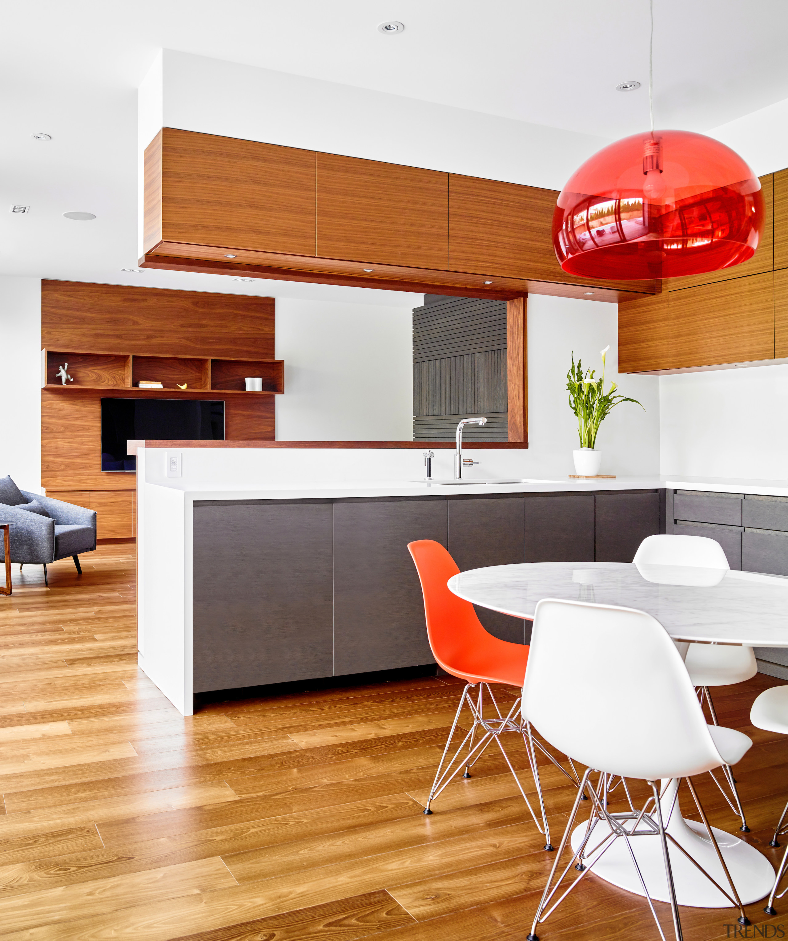 A translucent pendant in the kitchen mirrors the 