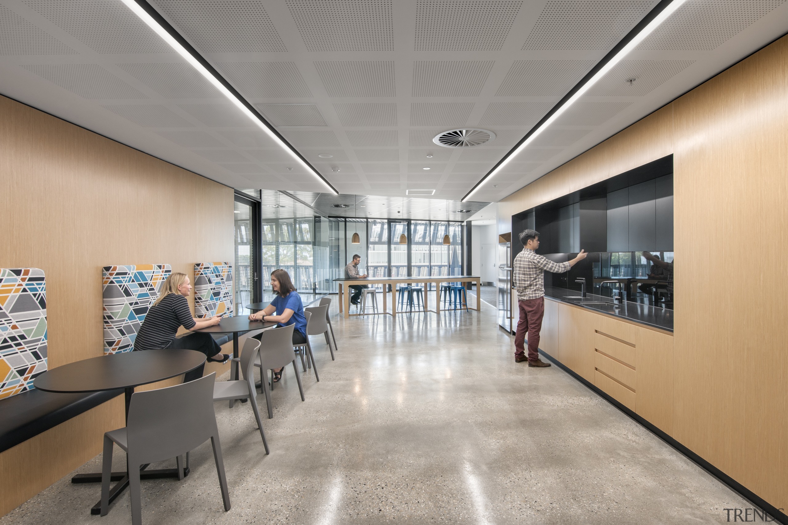 The facilitys cafeteria looks down onto the core architecture, ceiling, daylighting, institution, interior design, lobby, office, gray