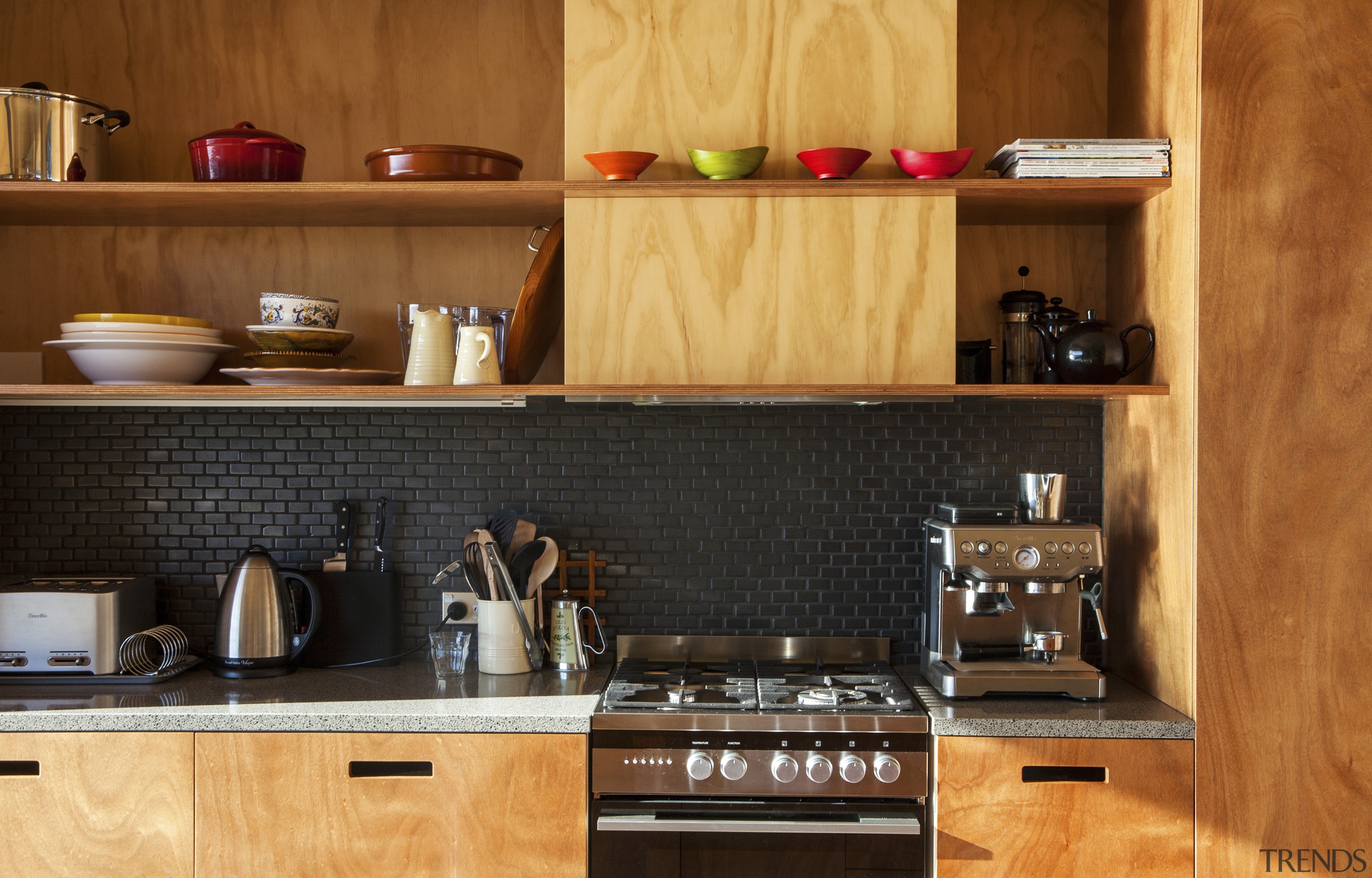 Gaboon shelving in this new holiday home contrasts cabinetry, countertop, cuisine classique, interior design, kitchen, kitchen organizer, wood, brown, orange