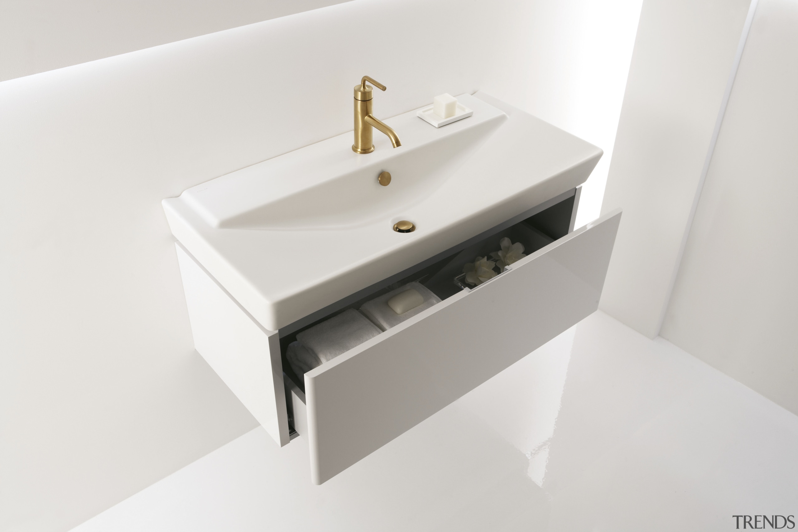 View of a Kohler basin with gold faucets bathroom, bathroom accessory, bathroom cabinet, bathroom sink, ceramic, drawer, plumbing fixture, product design, sink, tap, white