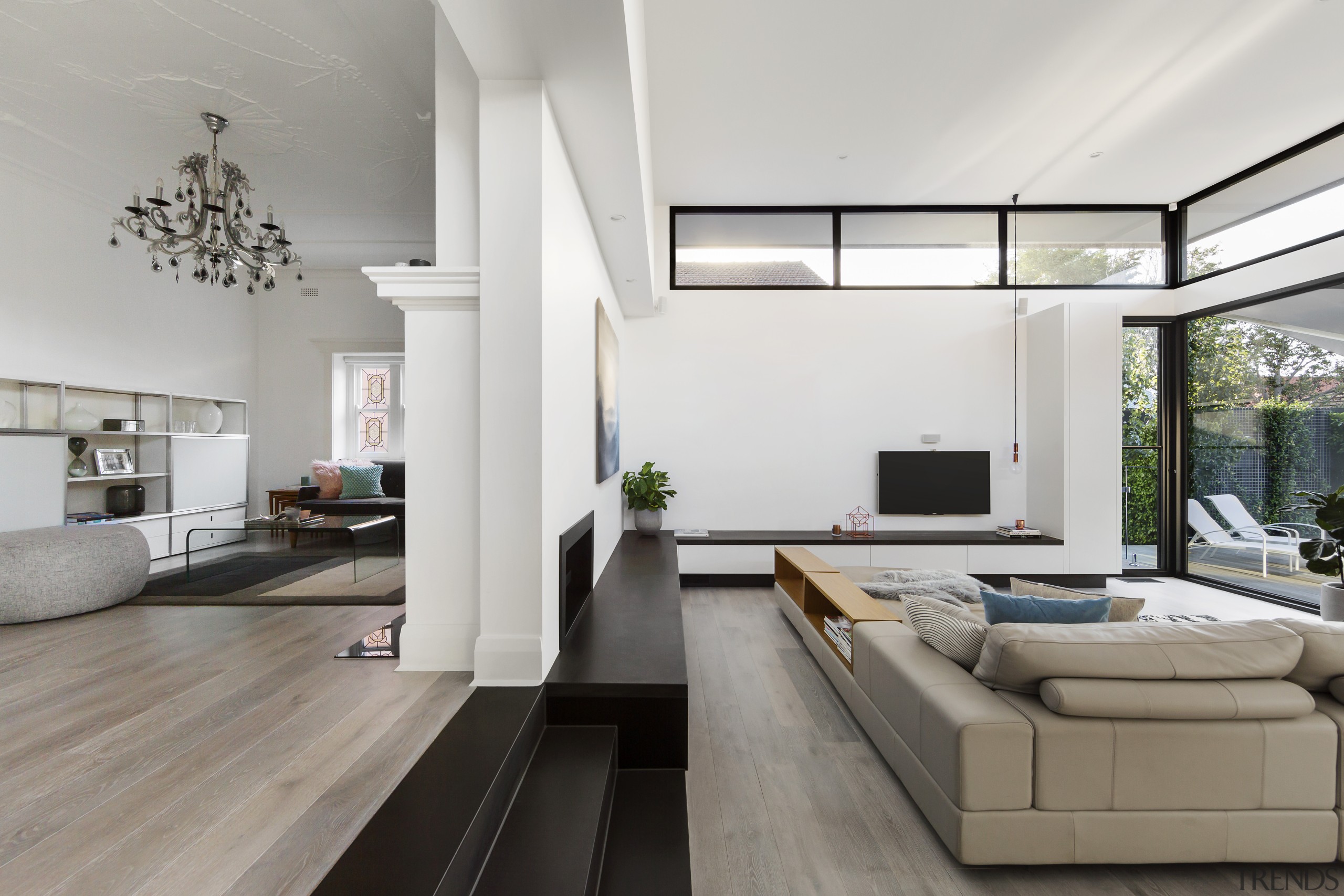 ​​​​​​​Clerestory windows flood light into this high-ceilinged addition architecture, timber floor, home, house, interior design, living room, white, LSA Architects