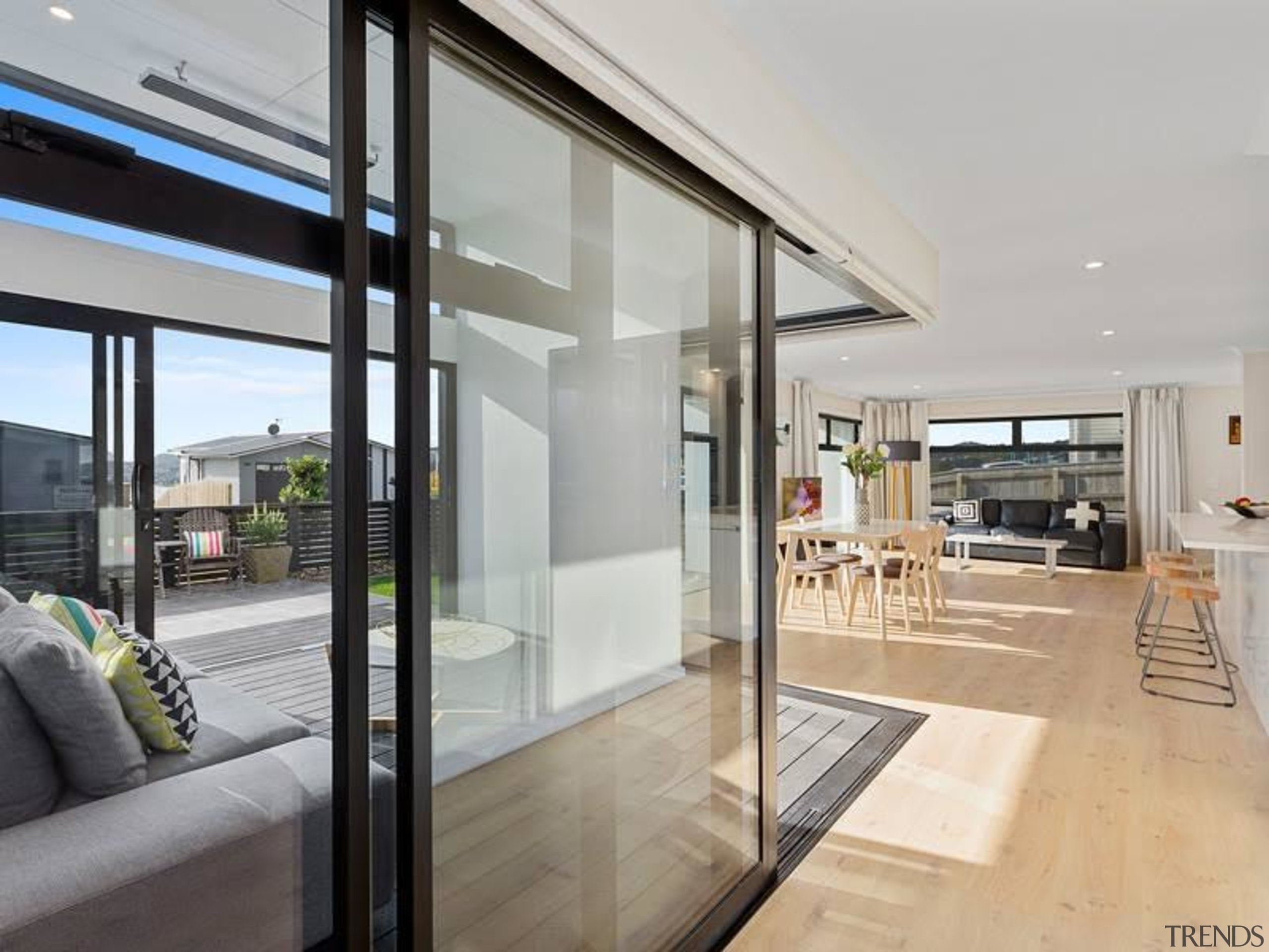 A conservatory can act as the lung of aluminium, apartment, architecture, automotive exterior, building, ceiling, daylighting, design, door, facade, floor, flooring, furniture, glass, home, home door, house, interior design, living room, loft, metal, property, real estate, room, sliding door, vehicle door, wall, window, gray