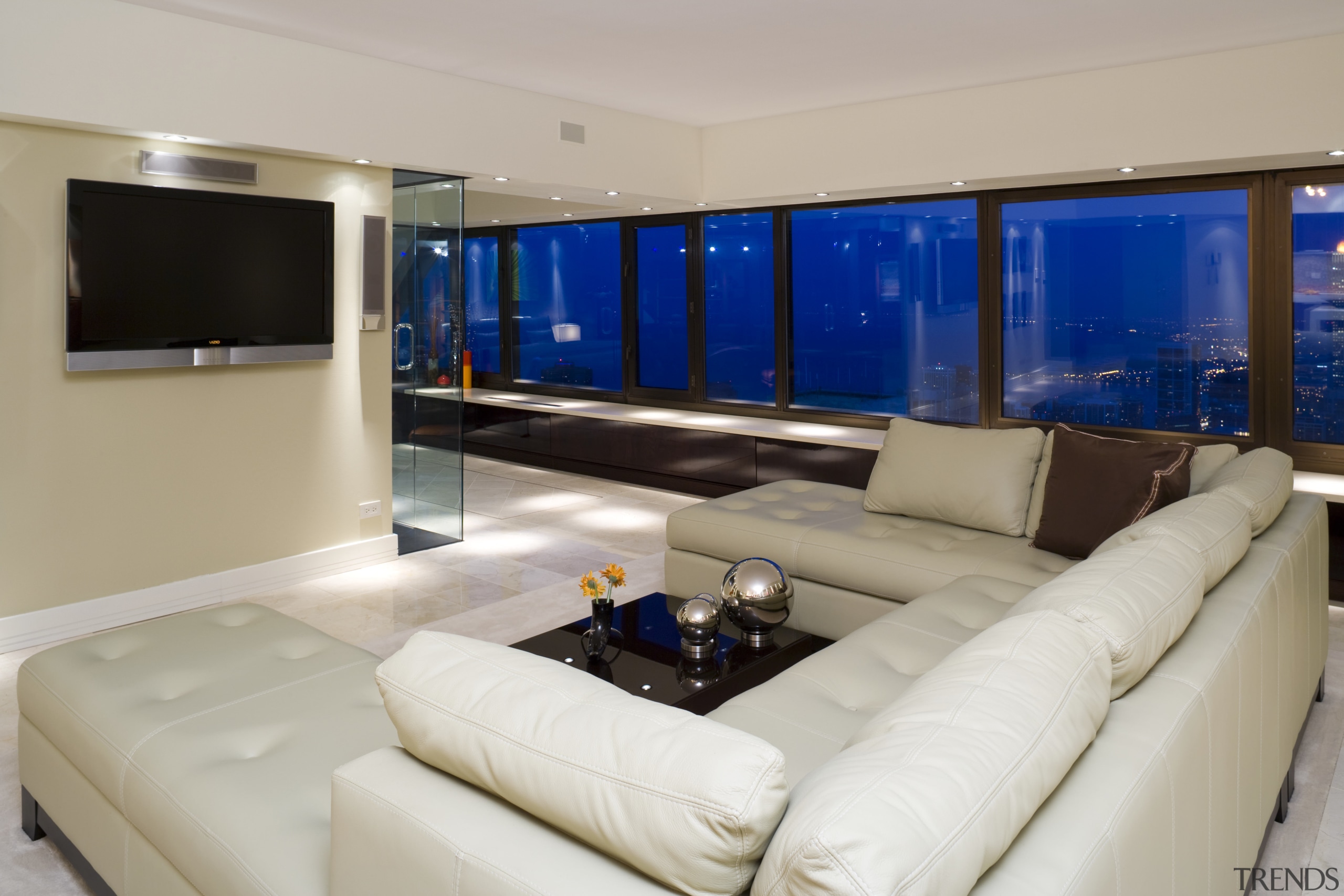 A glass wall in the office creates a interior design, living room, property, real estate, room, gray