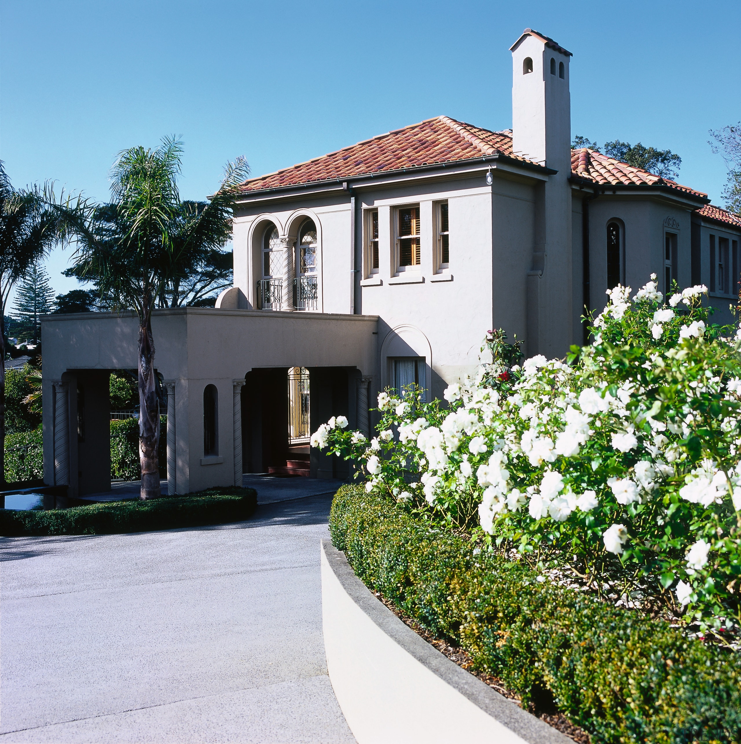 view of the entrance to the house framed building, cottage, estate, facade, flower, home, house, mansion, neighbourhood, plant, property, real estate, residential area, villa, white