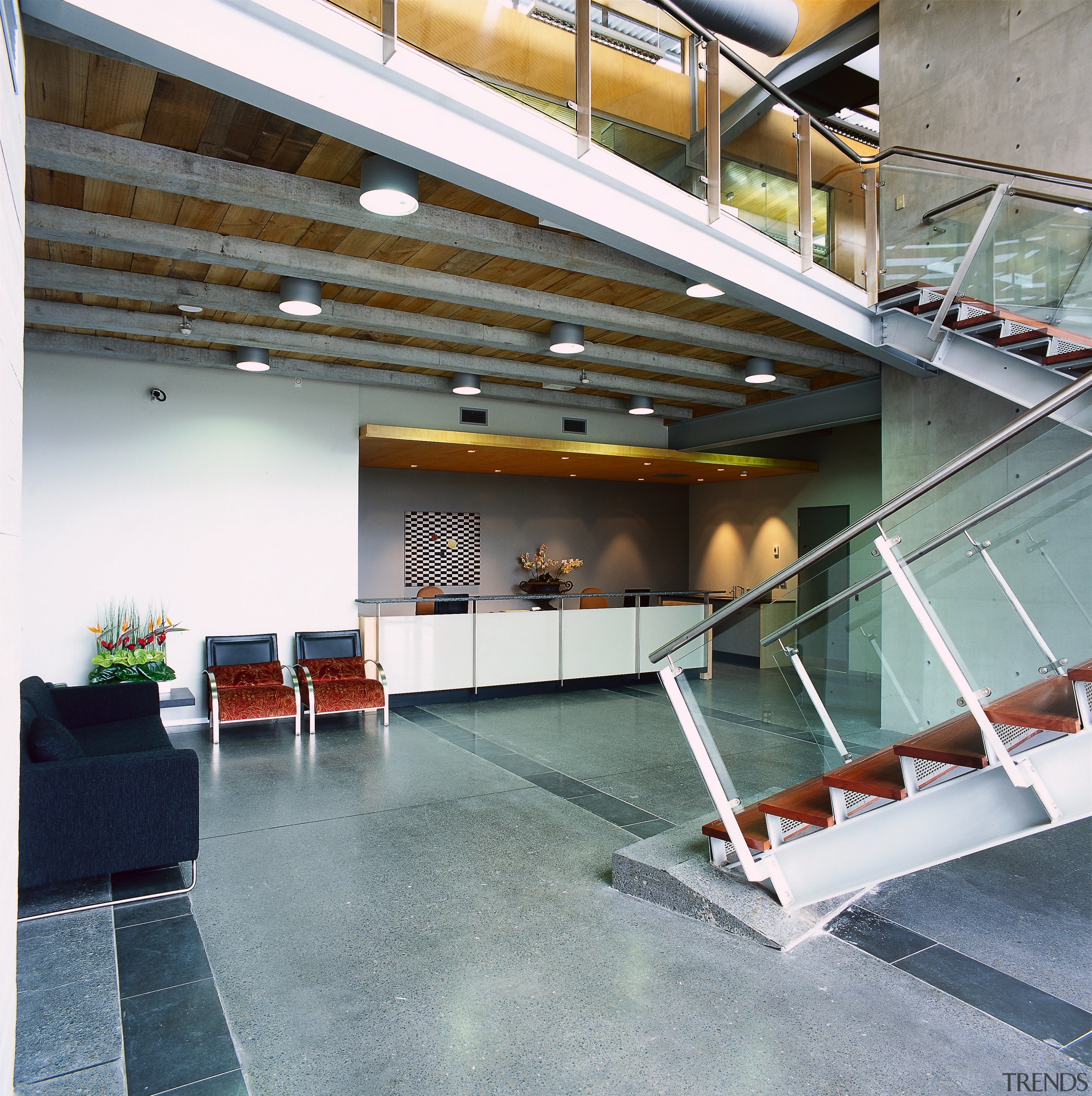 Vie wof the reception area, concrete flooring with architecture, daylighting, floor, handrail, lobby, real estate, stairs, gray