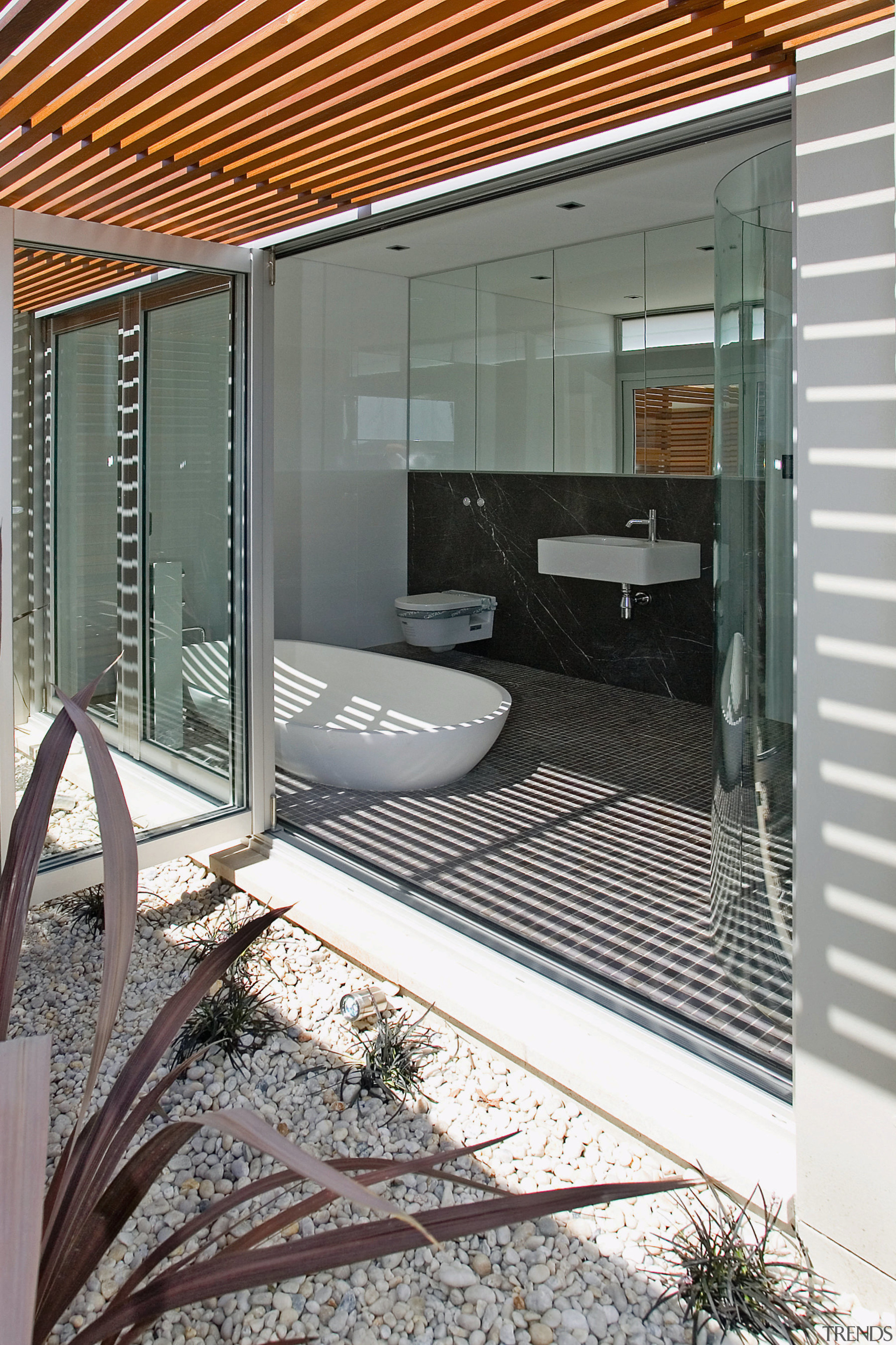 A view of some kitchen and bathroom cabinetry architecture, door, facade, glass, house, real estate, window, gray