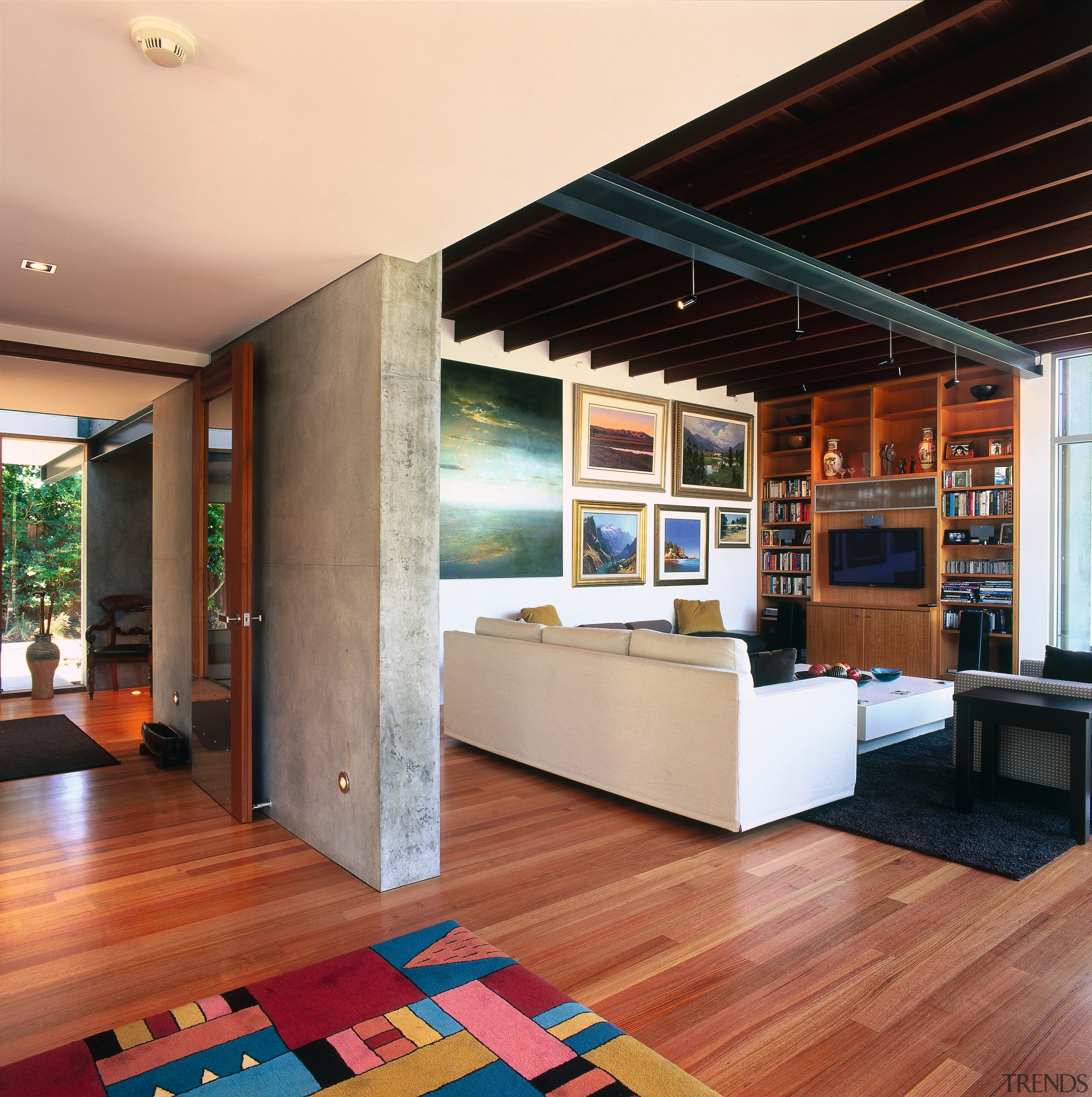 A view of the living area featuring white architecture, ceiling, floor, flooring, hardwood, house, interior design, living room, real estate, wood, wood flooring, orange