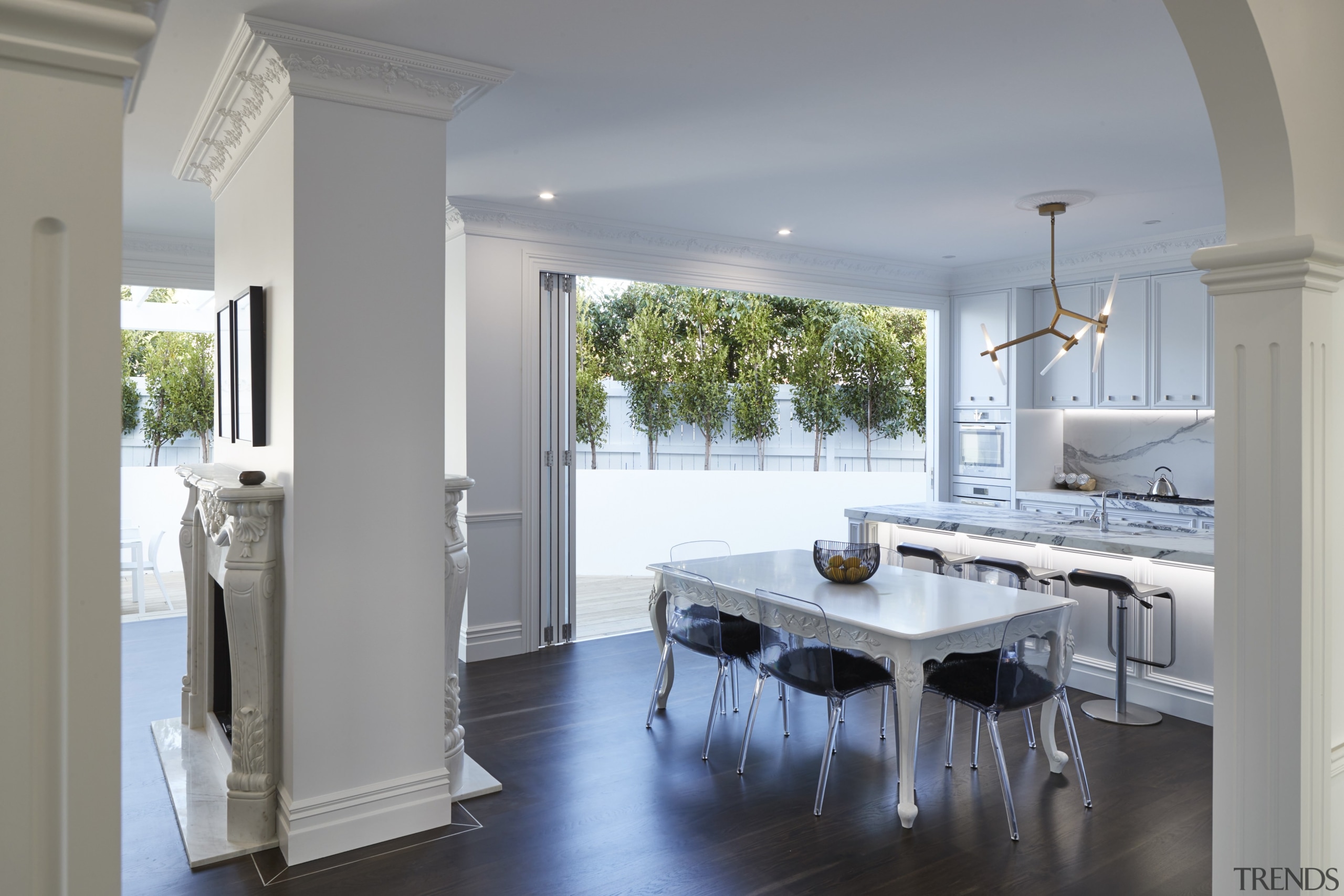 ​​​​​​​Part of a transformative villa renovation, this central, countertop, floor, timber flooring, home, interior design, kitchen, Leushke Khan architect, KMD Kitchens, Universal Granite, Blanco, Kohler