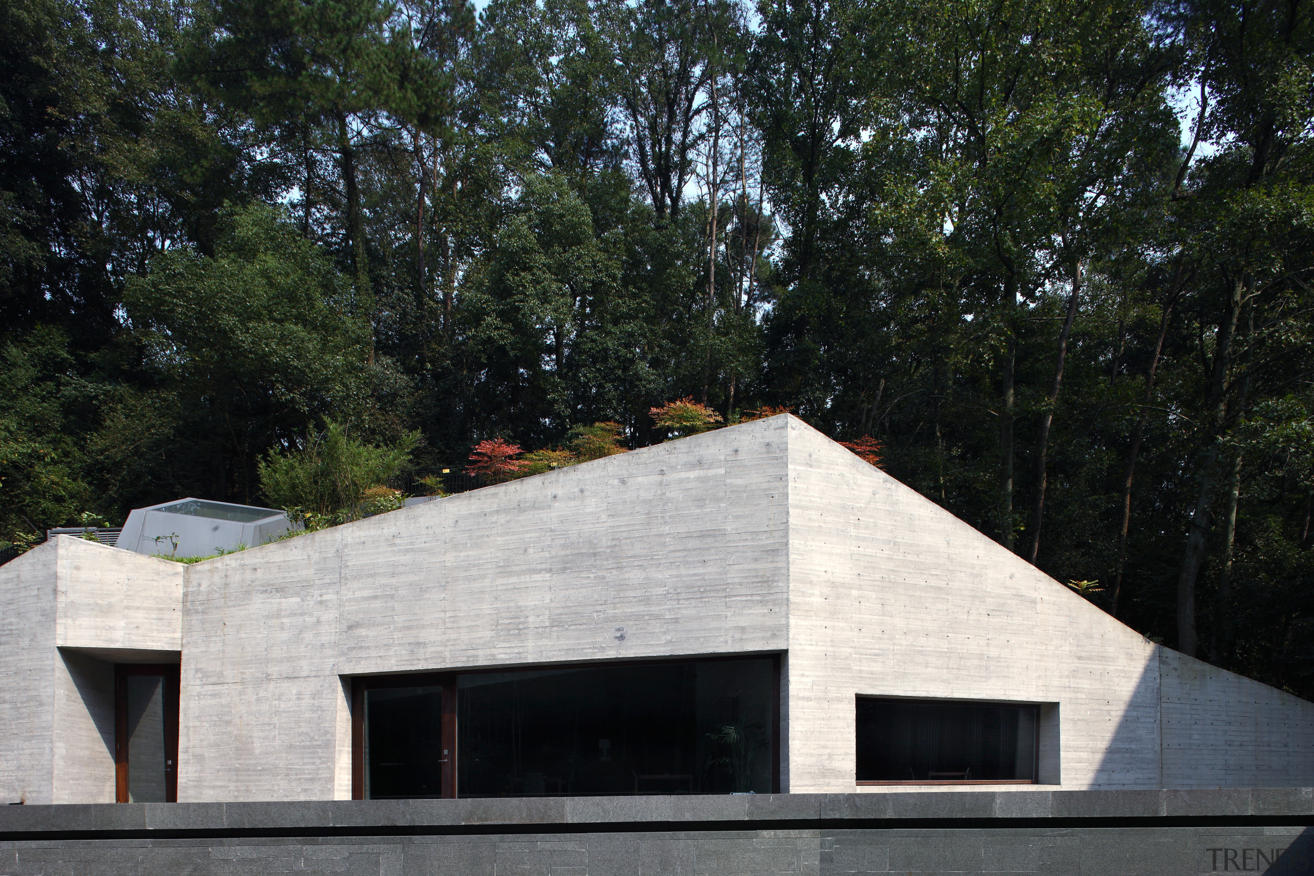 Exterior view of the clubhouse which features volcanic architecture, building, facade, house, roof, black