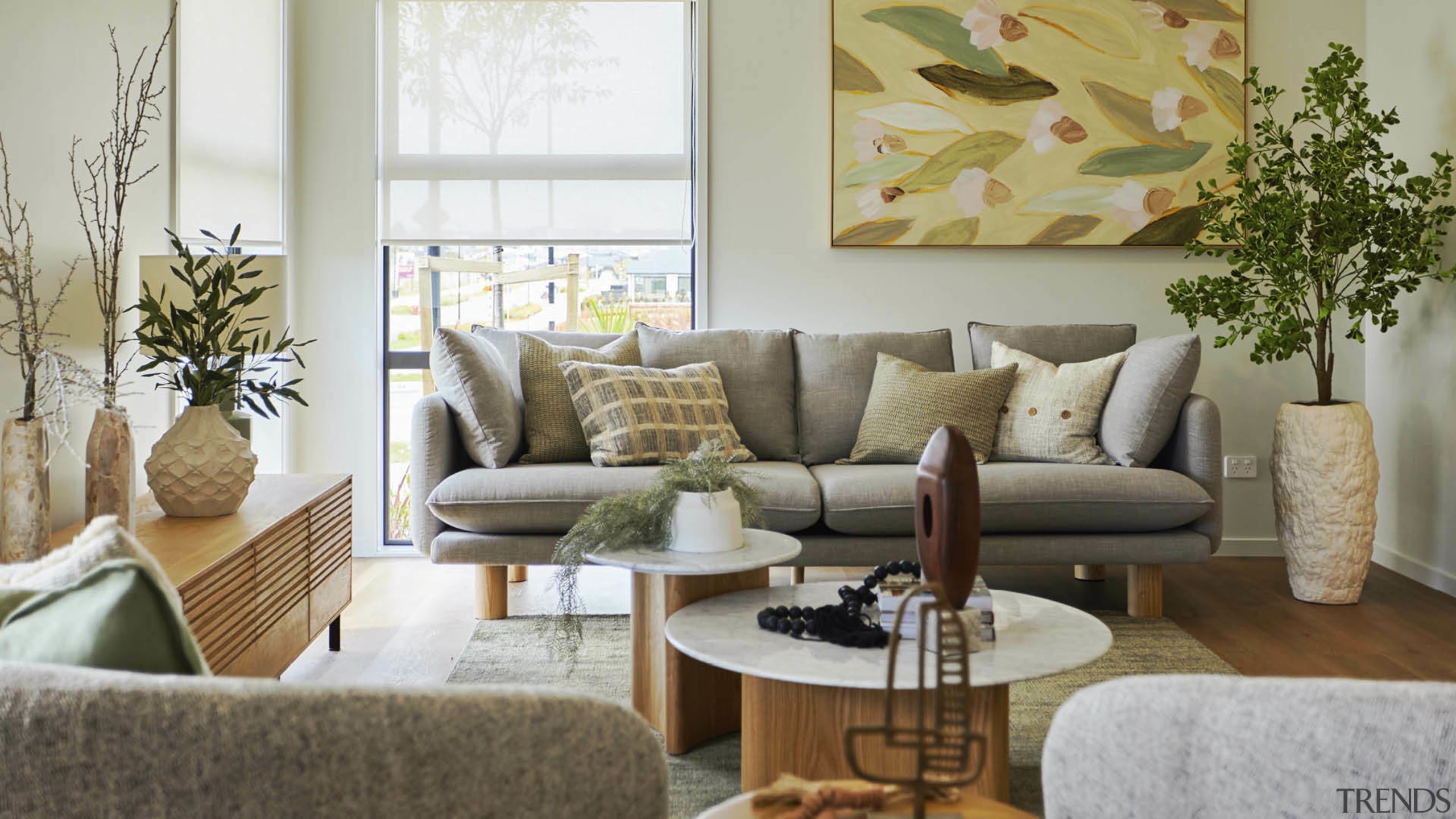 The airy living space with timber furniture accents 