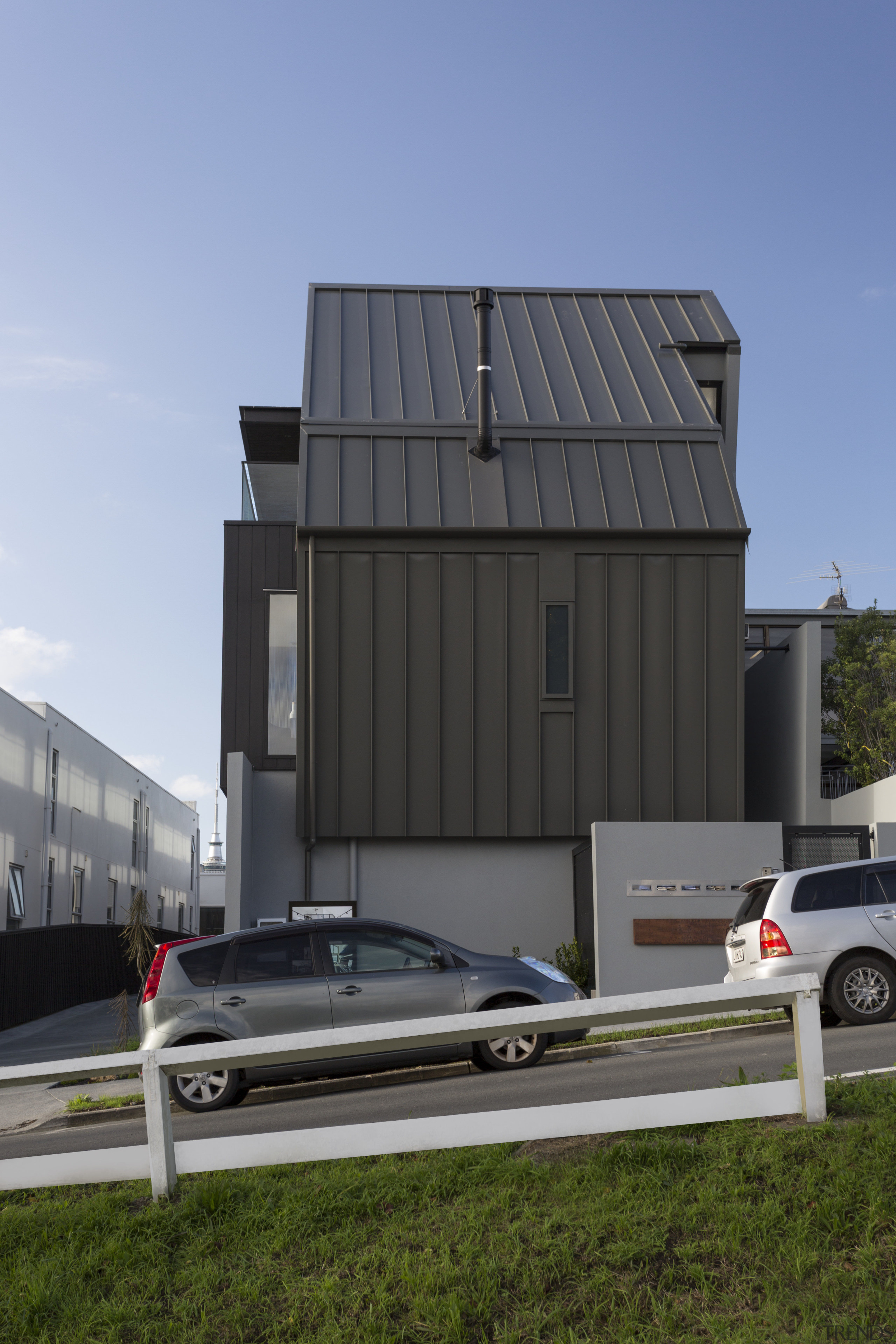 Dark-toned standing-seam aluminium cladding wraps up and down architecture, automotive exterior, building, car, facade, home, house, luxury vehicle, motor vehicle, real estate, shed, siding, vehicle, gray, teal