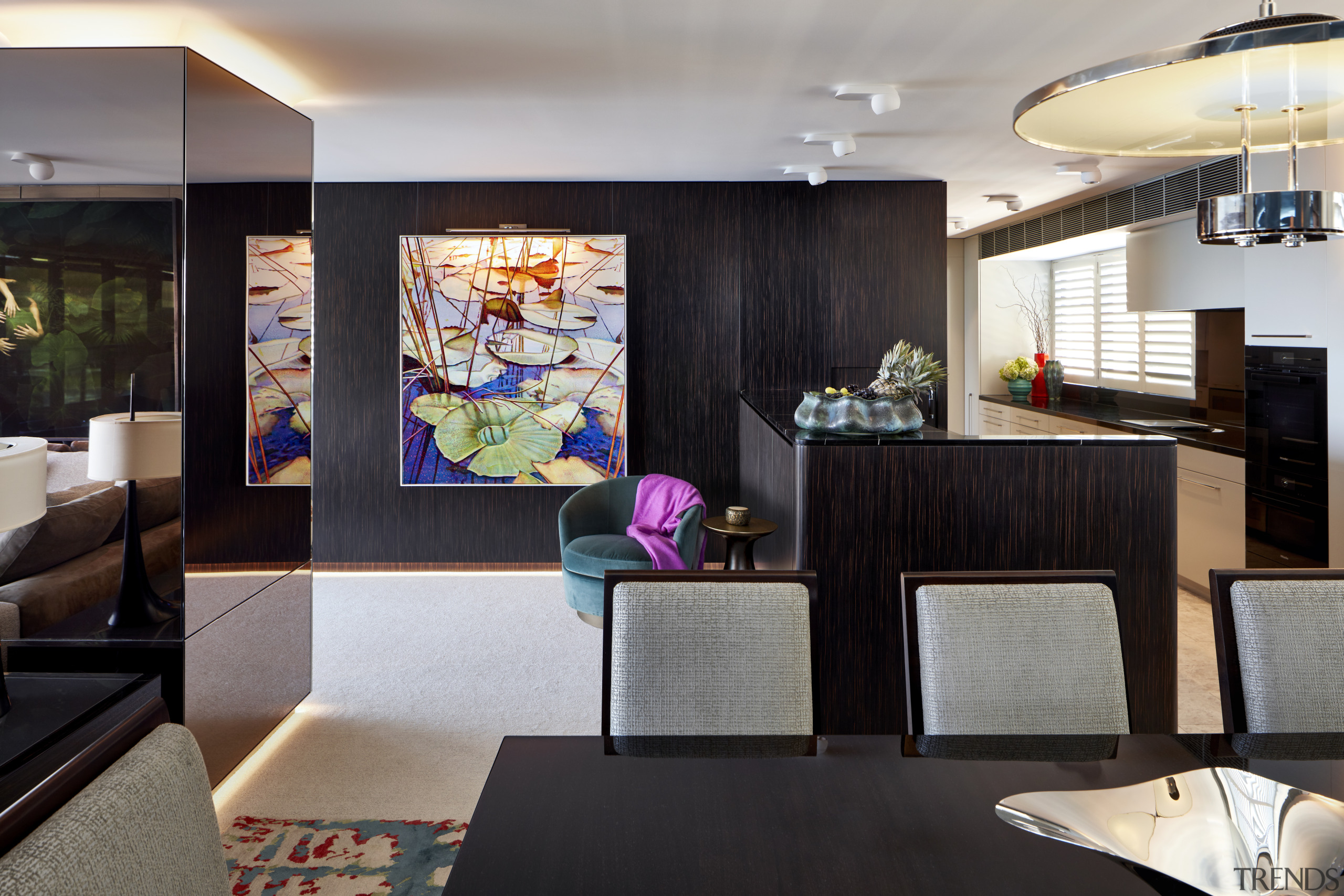 ​​​​​​​In the living area of this apartment, a architecture, design, floor, furniture, home, house, interior design, living room, table, wall, black, gray, paintings, Richard Archer Design