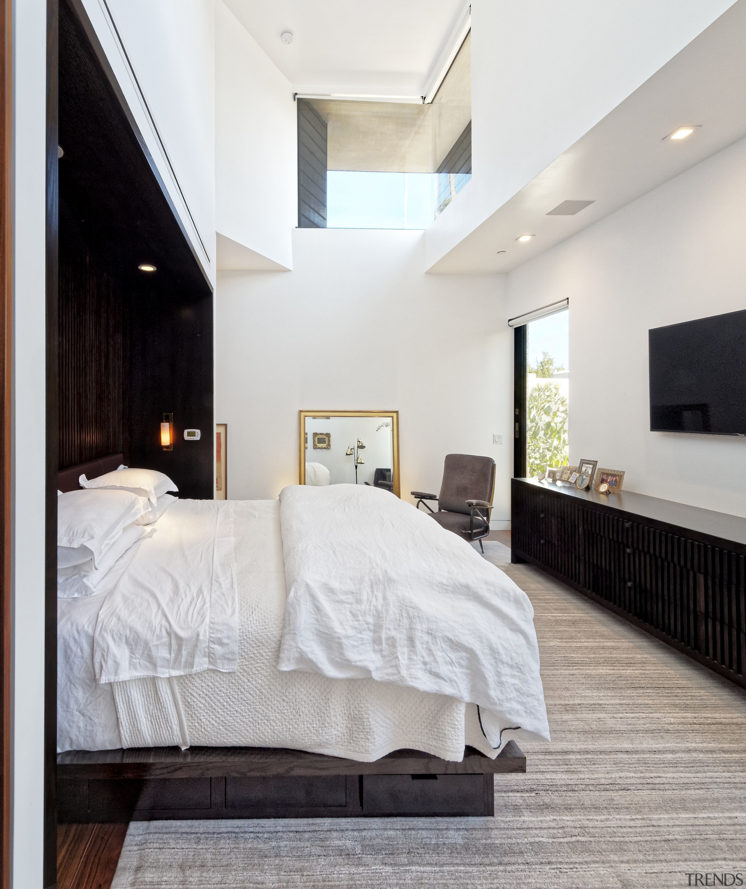 A clerestory window high on the 5.5m-high front bed, bed frame, bedroom, ceiling, floor, flooring, furniture, home, interior design, real estate, room, suite, wood, gray, white
