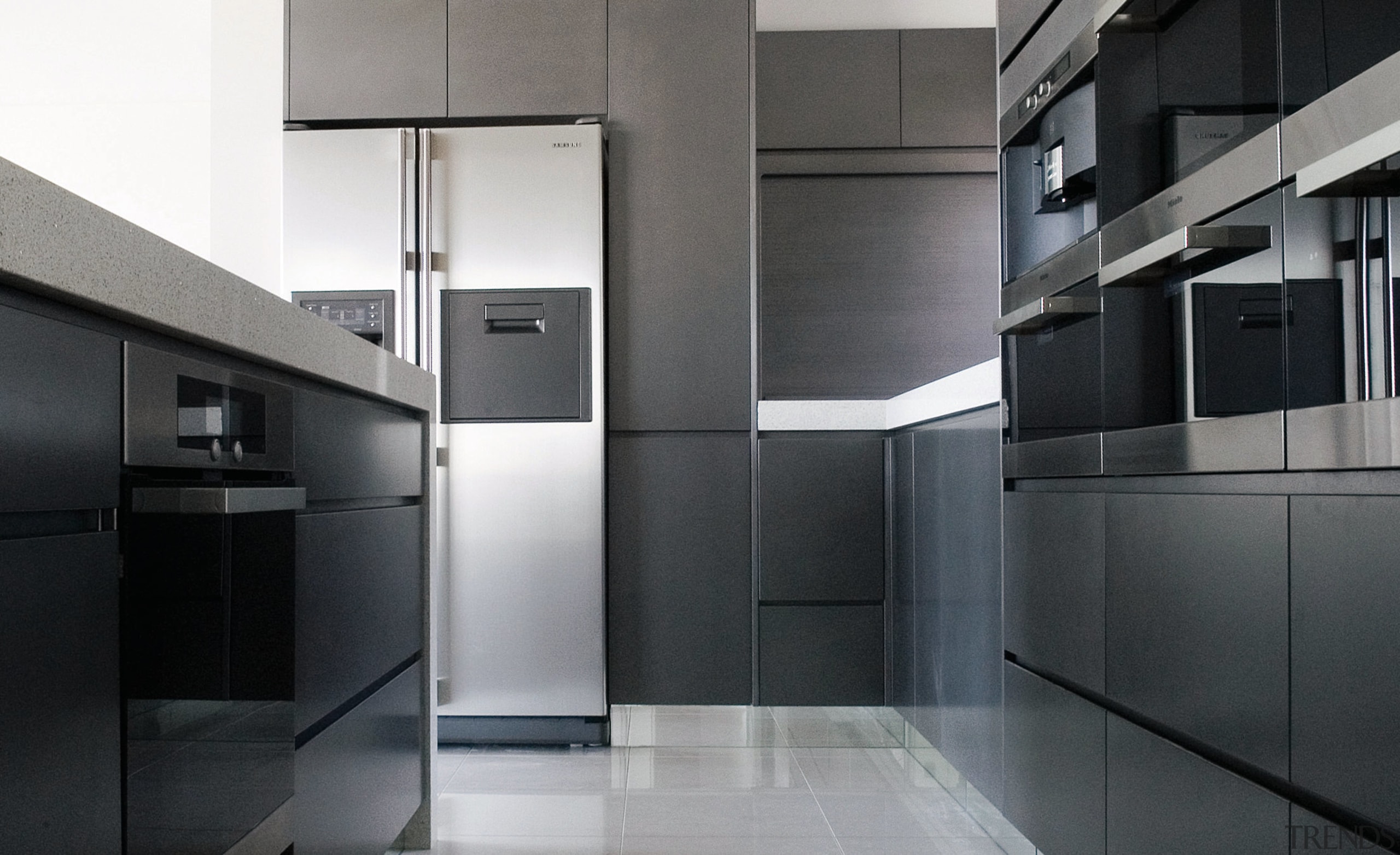 View of this modern kitchen designed by DK architecture, interior design, kitchen, product design, black, gray