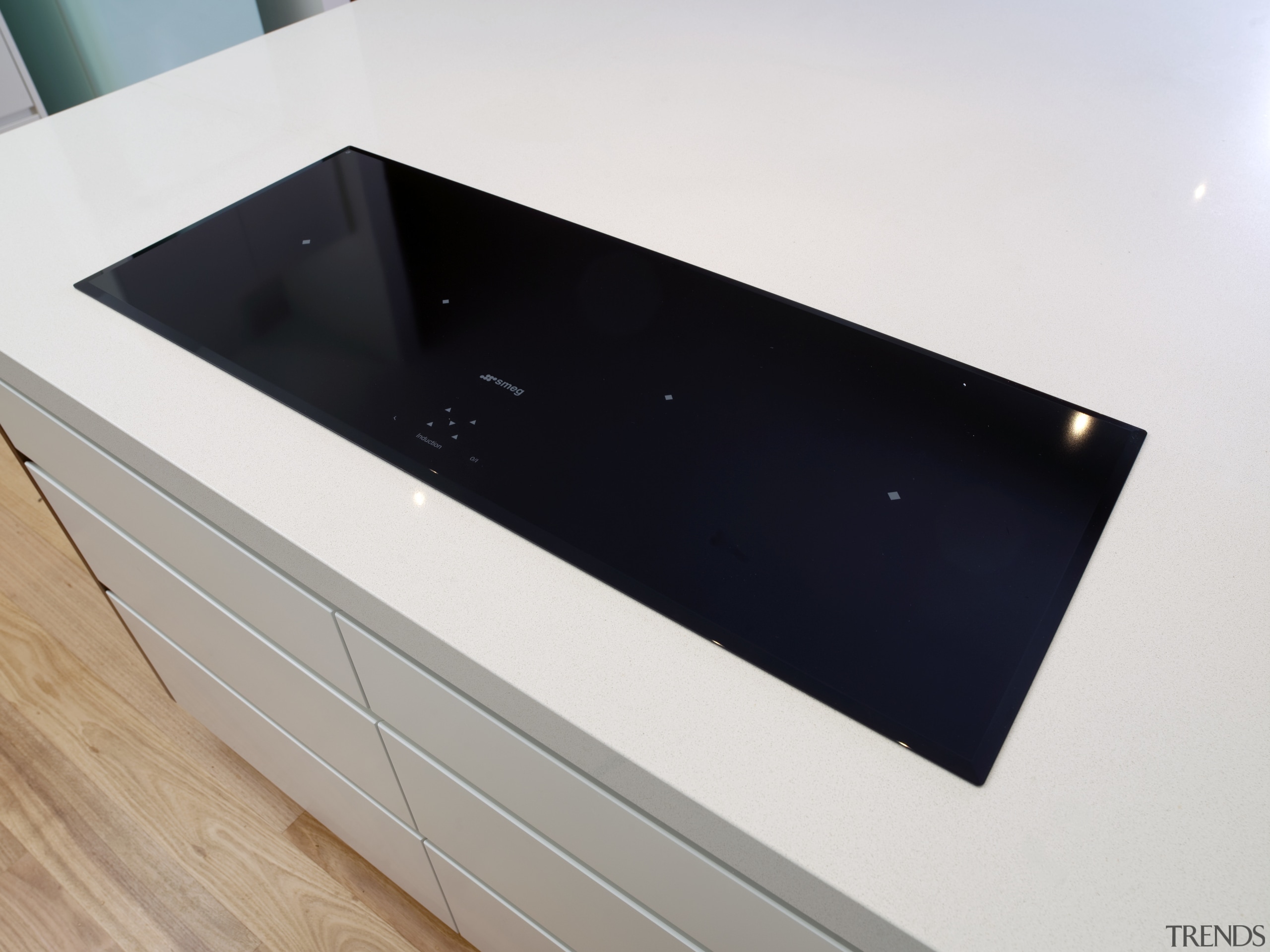 View of contemporary cooktop on white benchtop. - bathroom sink, countertop, hardware, plumbing fixture, product design, sink, white