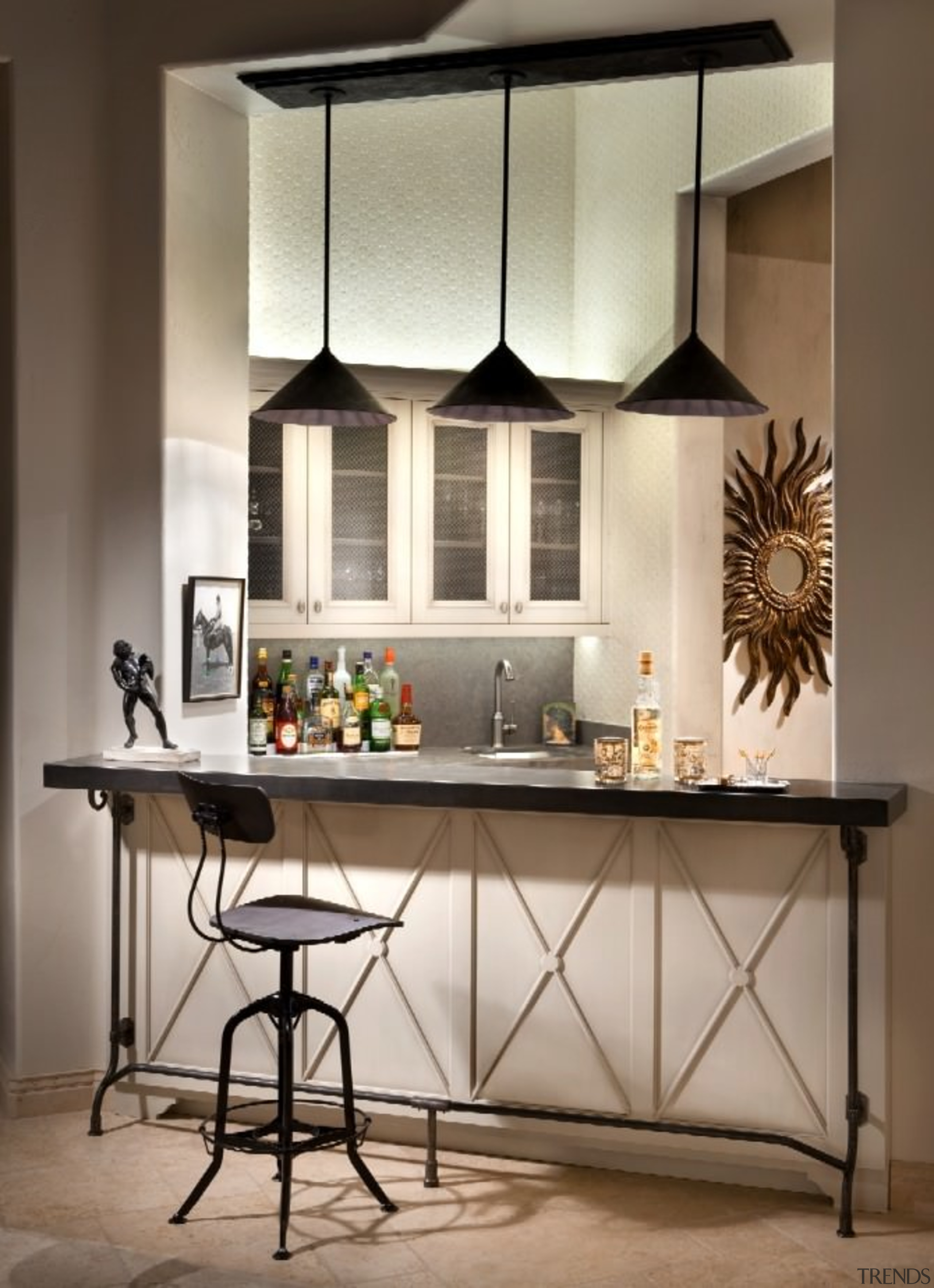 Three pendant lights hang above this bar area cabinetry, countertop, cuisine classique, furniture, interior design, kitchen, table, gray, brown