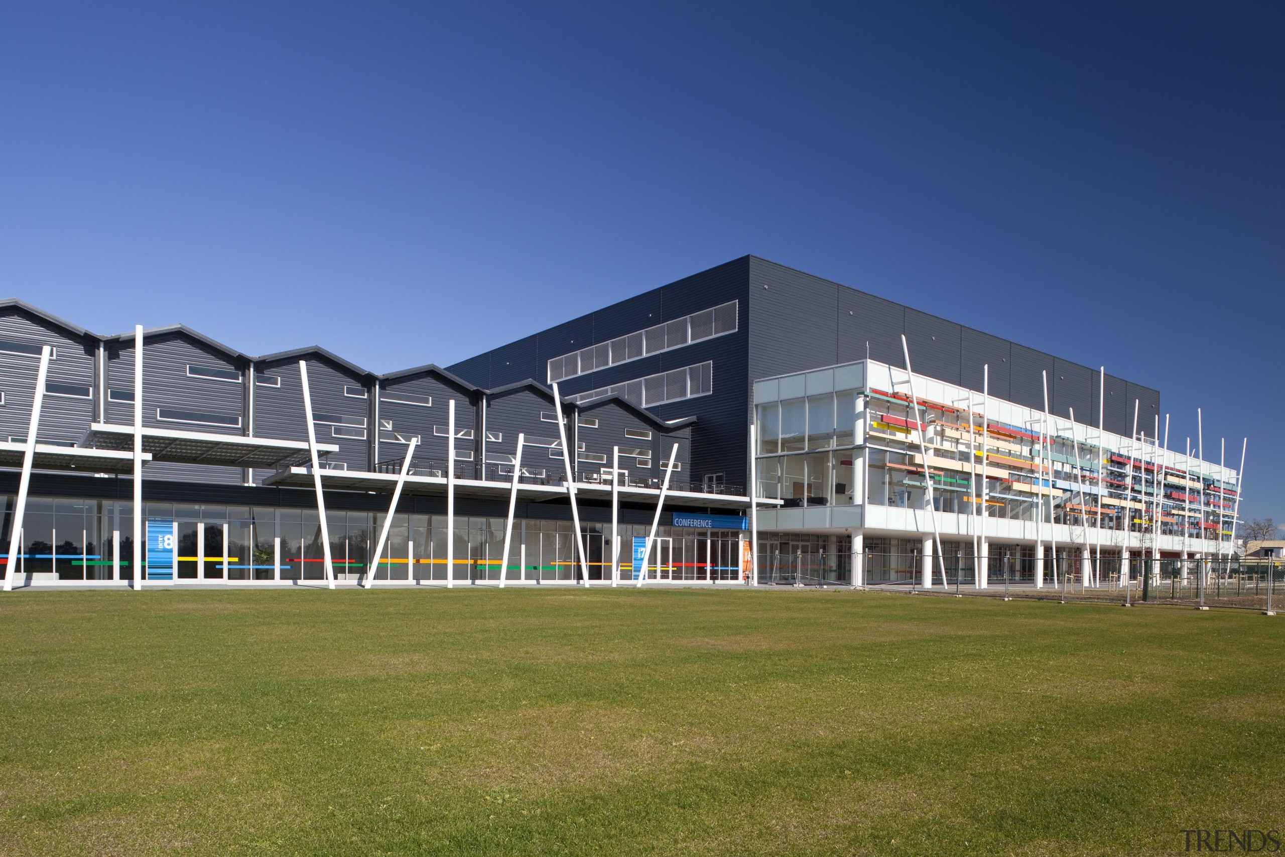External view fo Claudlands Arena, Hamilon. - External architecture, building, campus, commercial building, corporate headquarters, facade, grass, headquarters, mixed use, real estate, sky, sport venue, stadium, structure, blue, brown