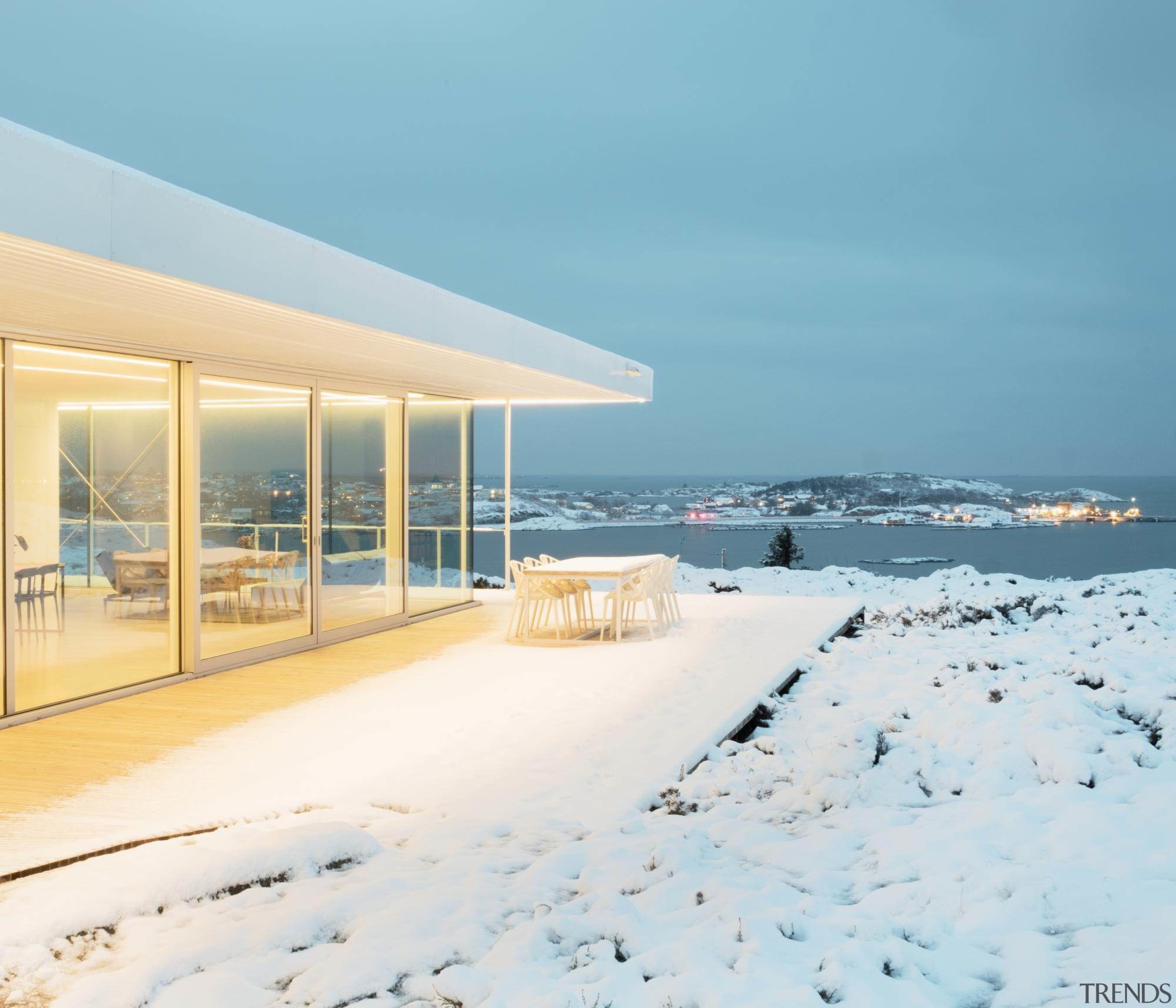 The home lights up at night - The home, real estate, sea, sky, snow, vacation, winter, white, teal