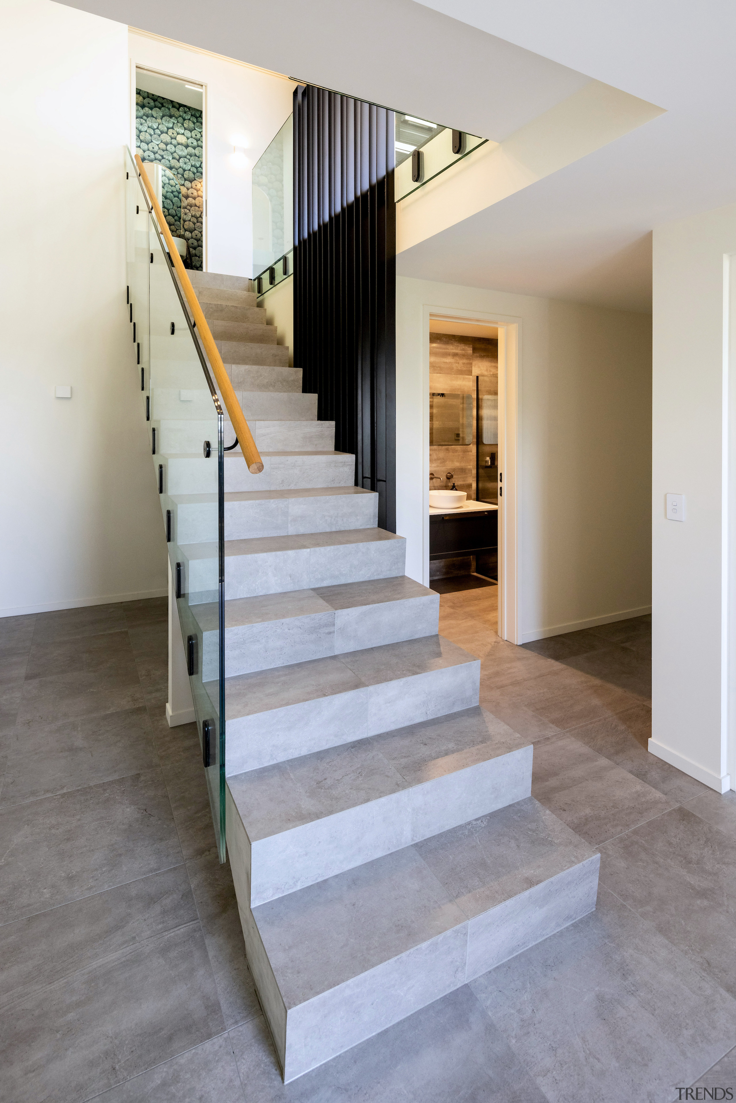 The sculptural concrete stair is an interior feature. 