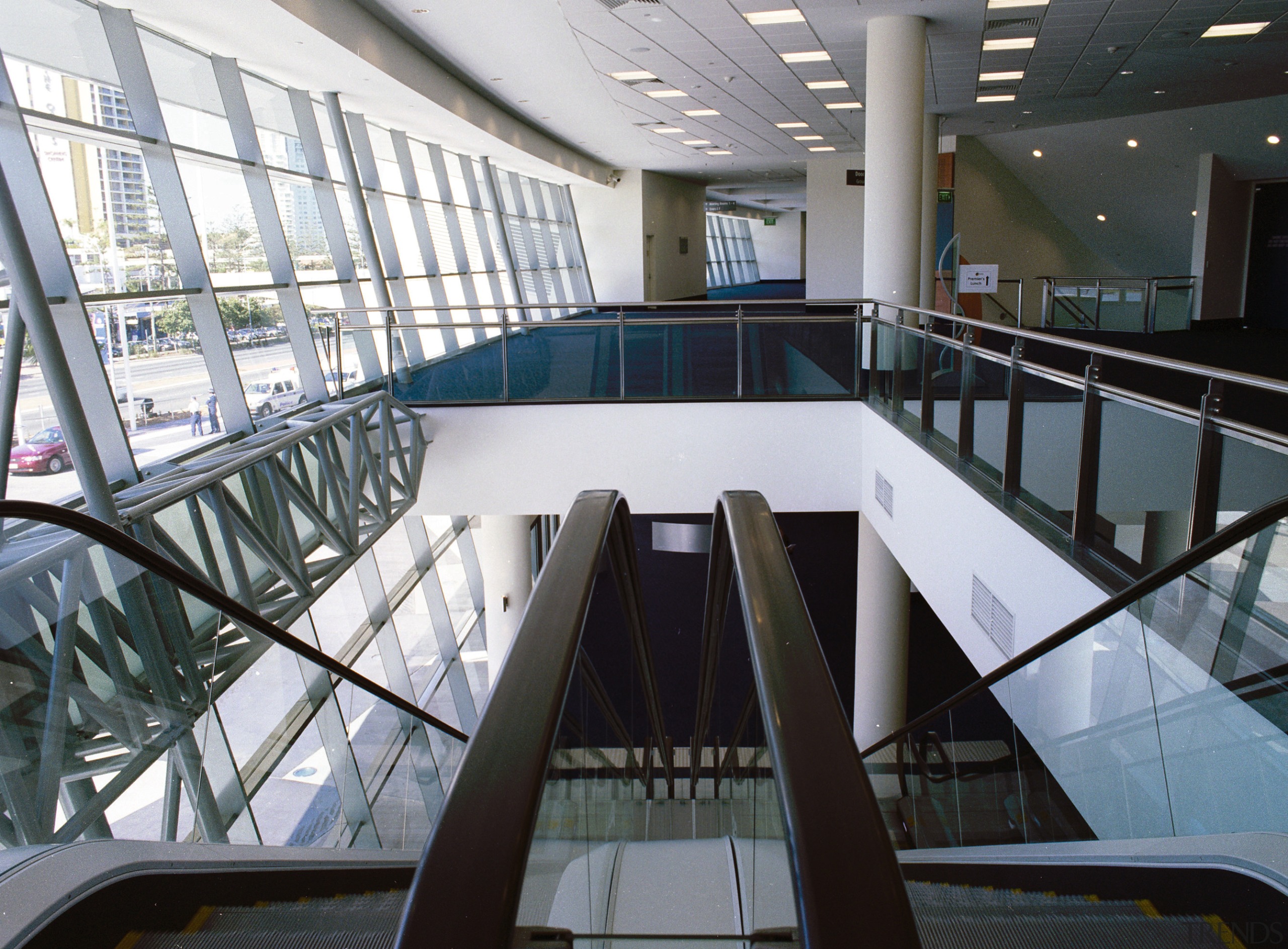 Interior of building looking down escalator to lower architecture, building, daylighting, glass, handrail, leisure centre, metropolitan area, stairs, structure, gray, black