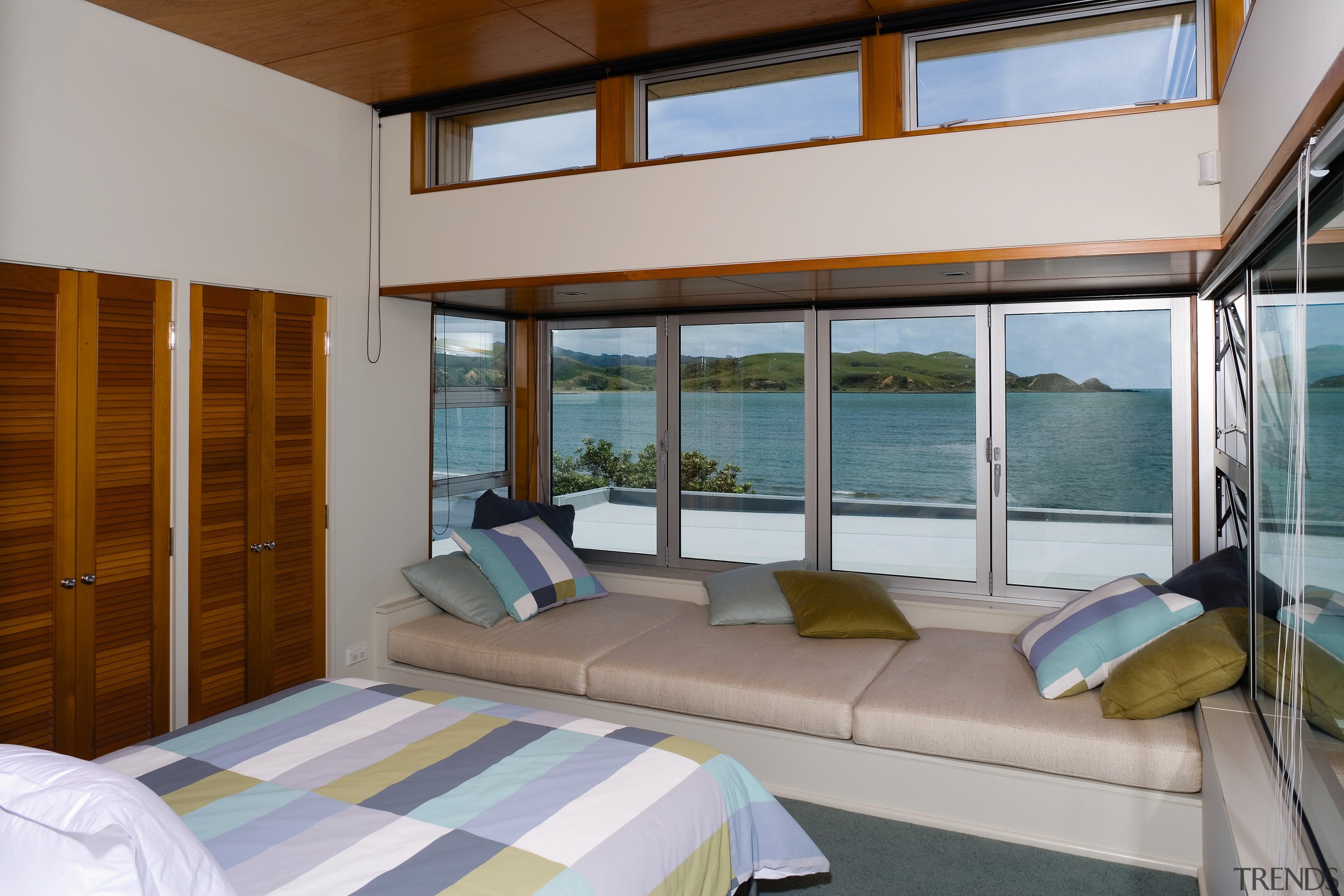 View of the master bedroom featuring extensive glazing architecture, bedroom, door, estate, house, interior design, real estate, room, window, gray