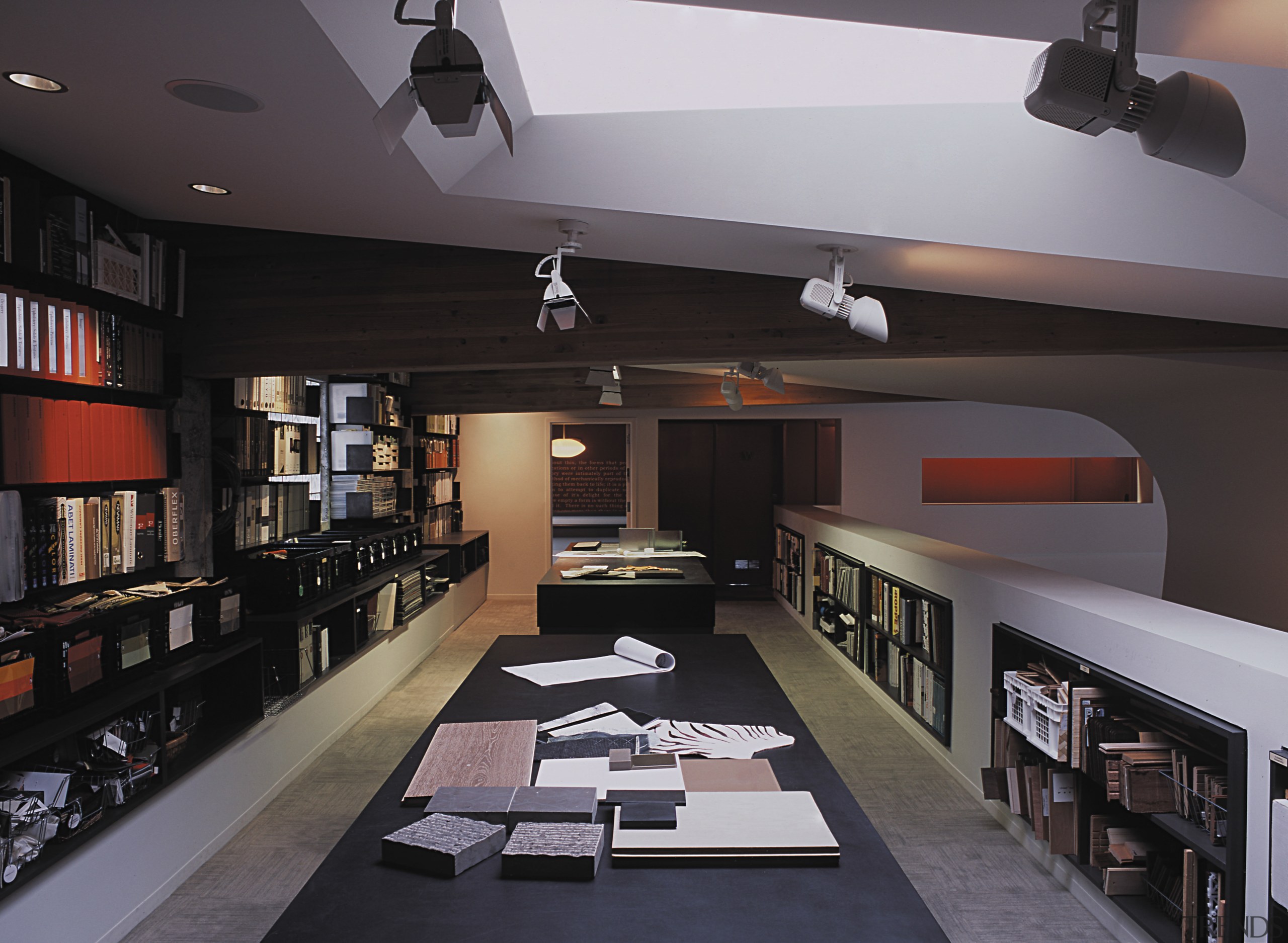 On the mezzanine level, the sculptural walls wraps interior design, black, gray