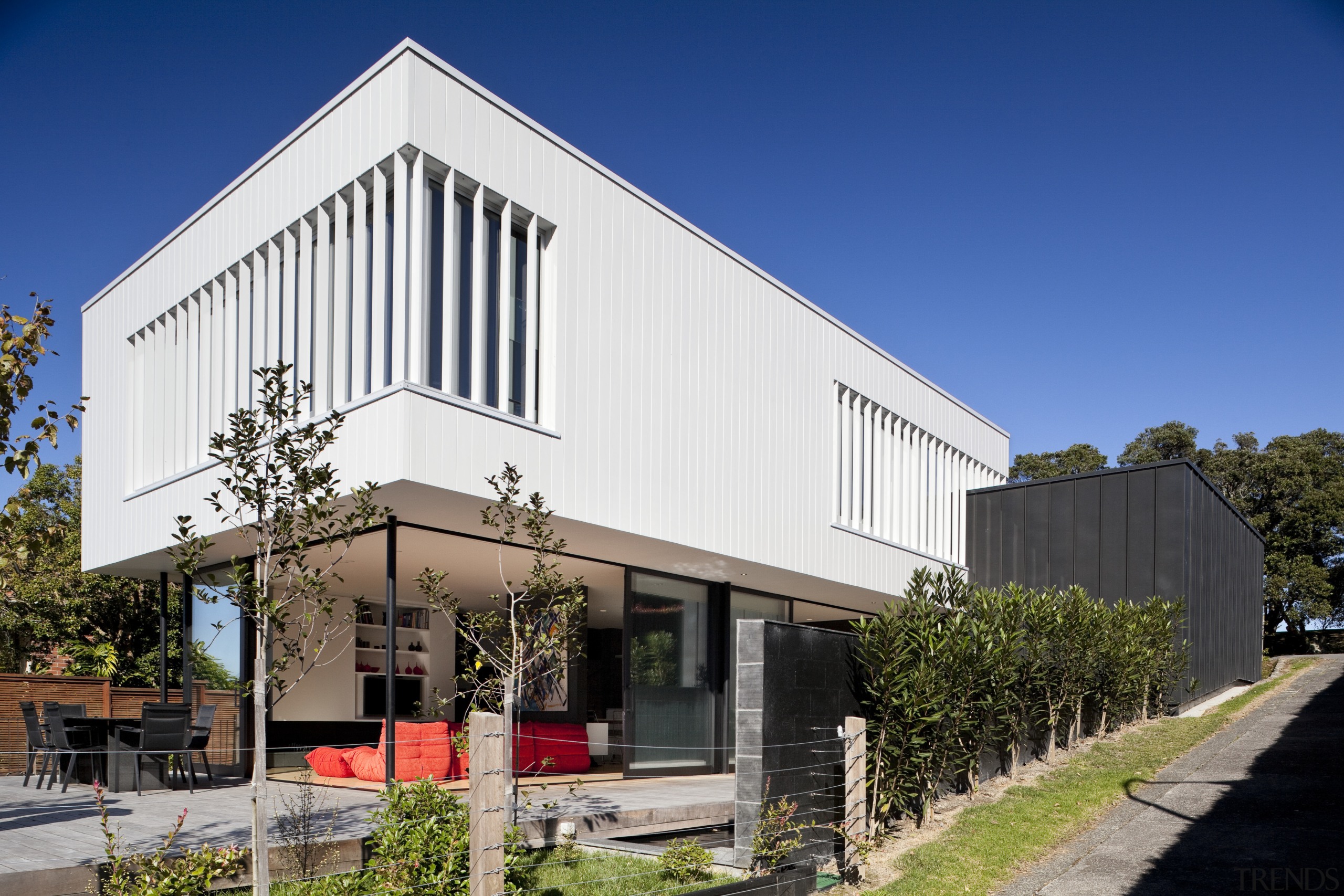 Here is a view of a home that architecture, building, commercial building, facade, house, real estate, blue, white