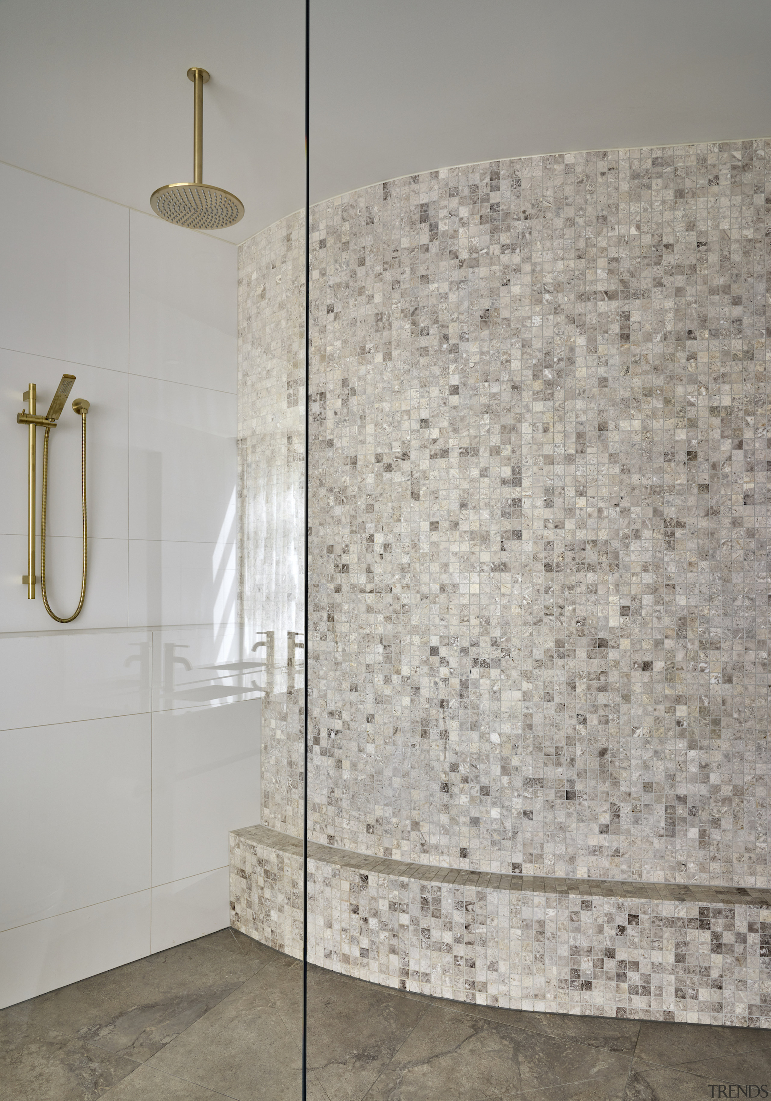 The curvaceous mosaic shower wall is another design 