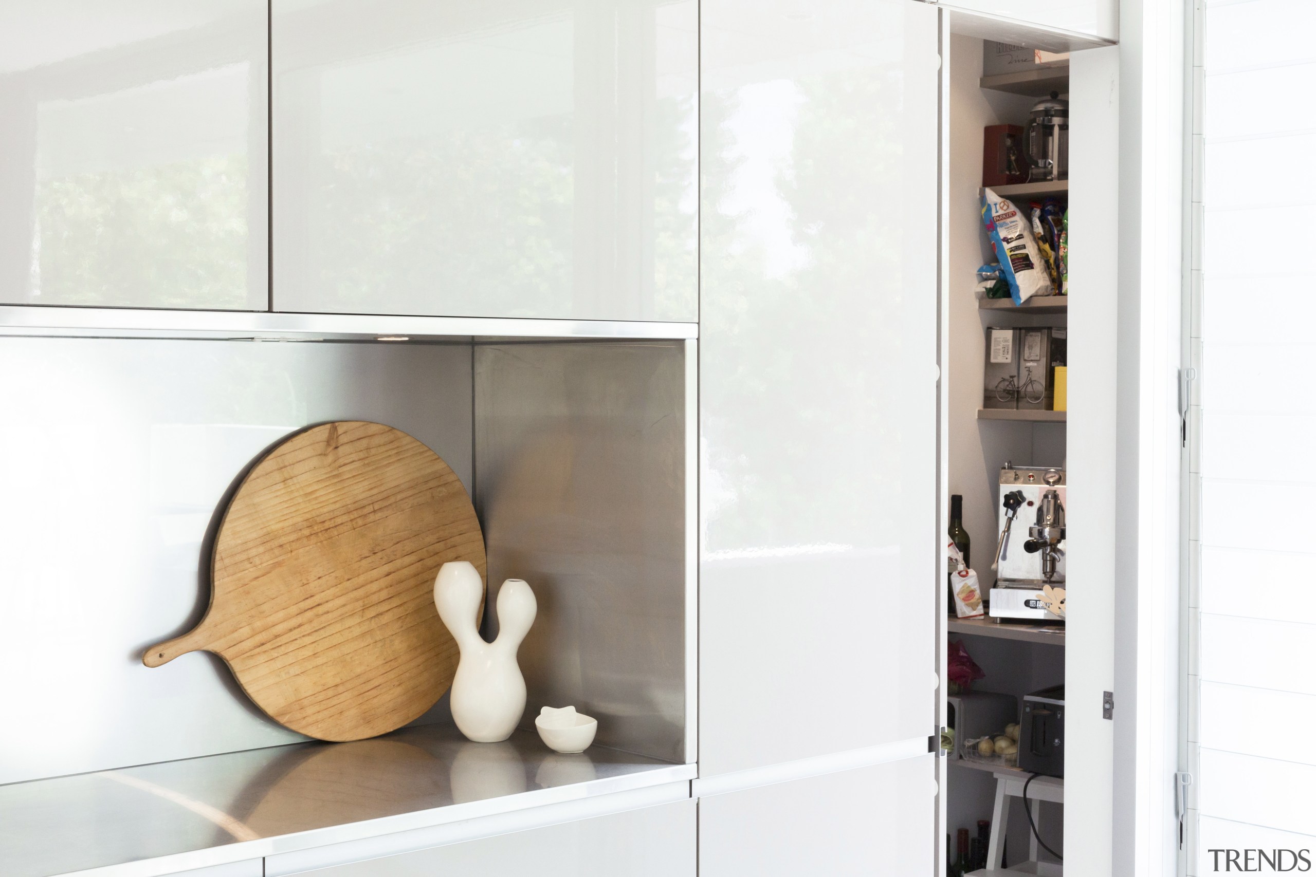 In this kitchen by Nancy Frost, the full furniture, interior design, product design, shelf, shelving, white