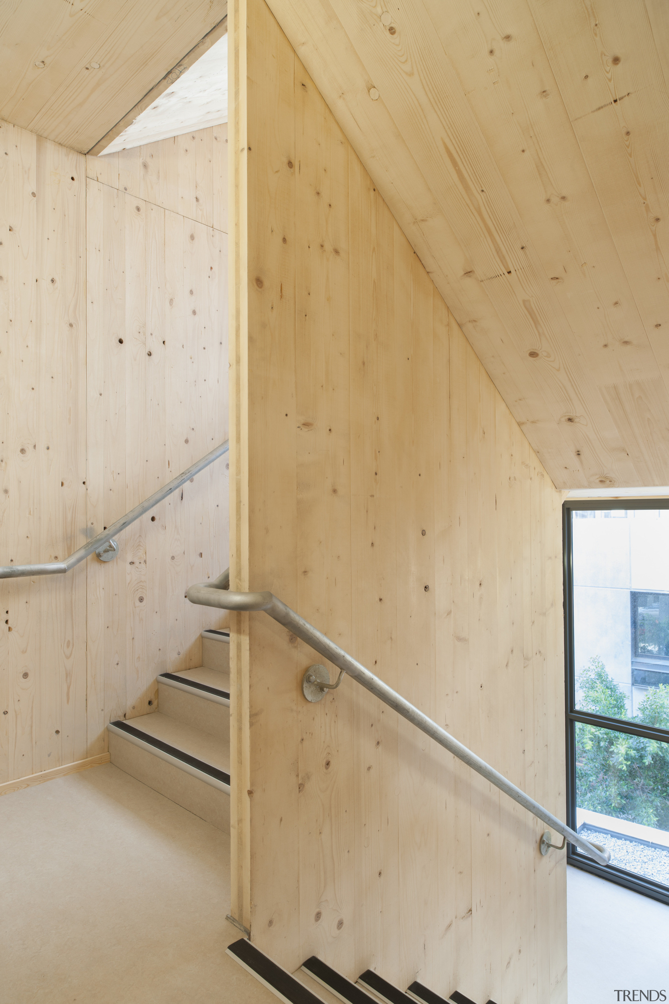 The stairwell and feature walls in the Forté architecture, ceiling, daylighting, floor, handrail, home, house, interior design, plywood, stairs, wall, wood, wood flooring, wood stain, orange