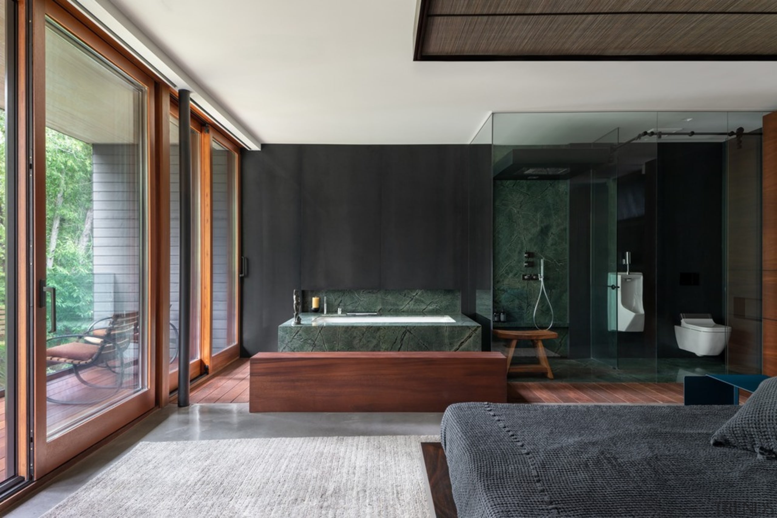 The master bedroom with open ensuite bathroom, and architecture, bed, bedroom, boutique hotel, building, ceiling, floor, furniture, hardwood, home, house, interior design, living room, loft, property, real estate, room, suite, black, gray