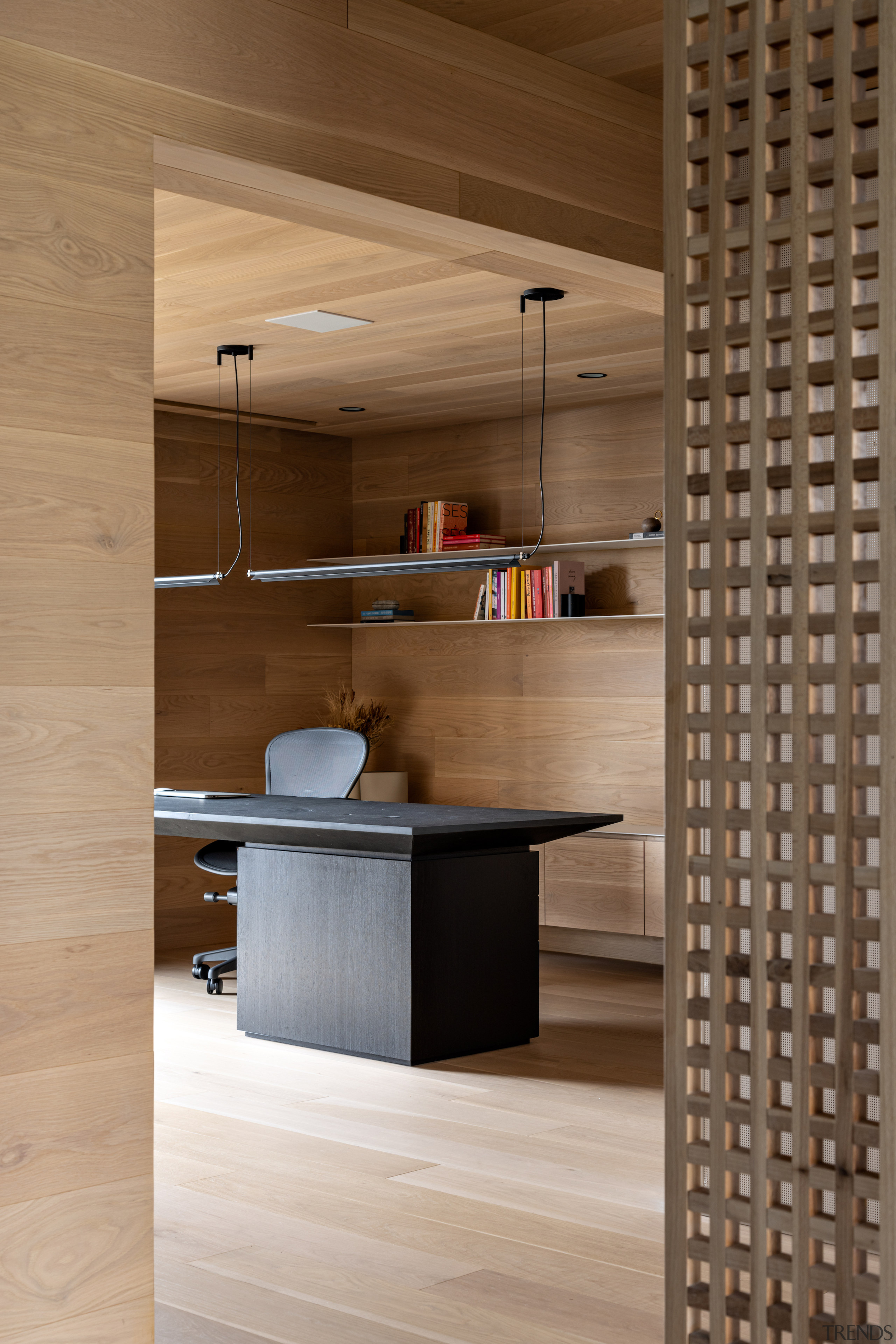 Study with sculptural and contrasting desk. 