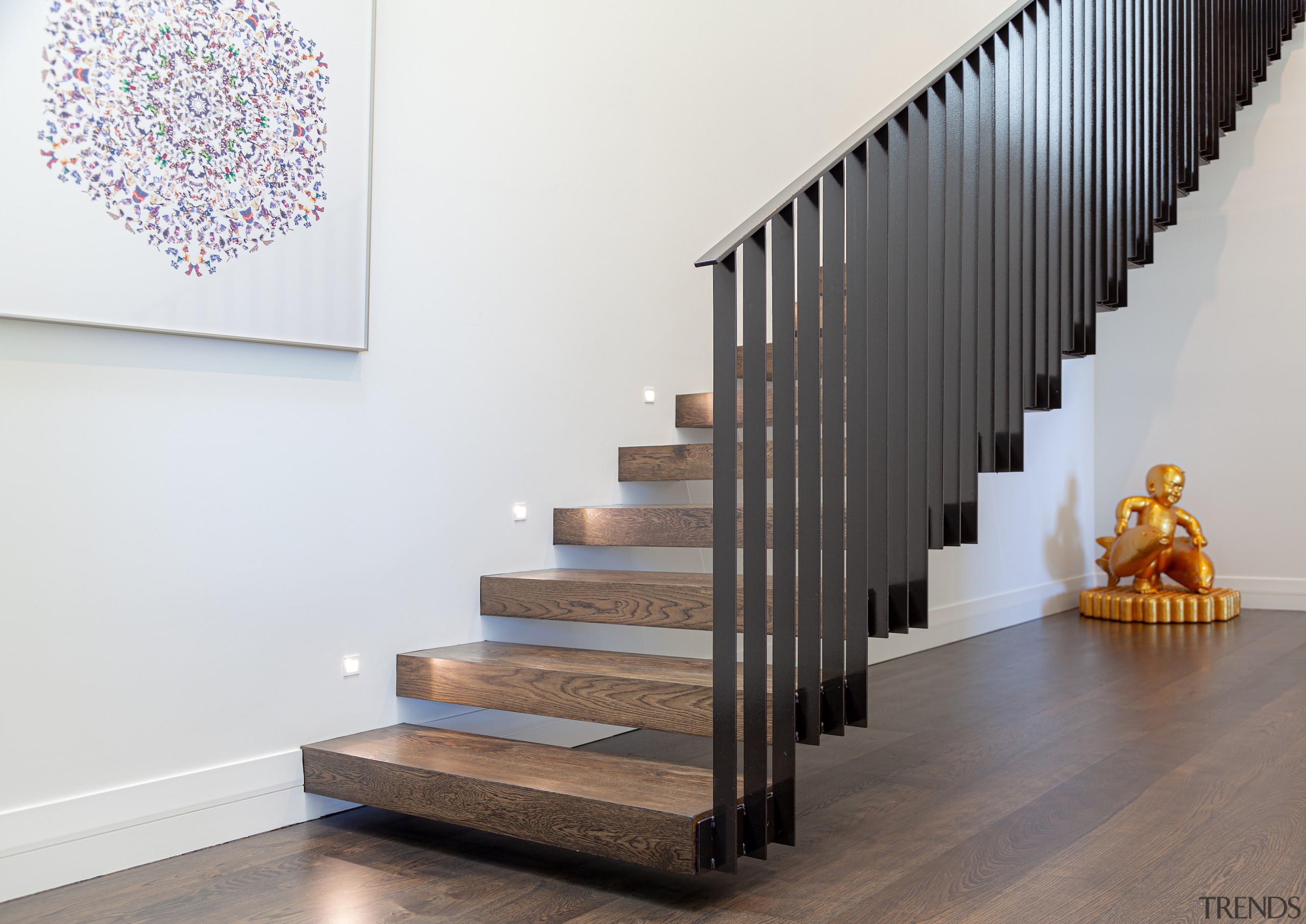 Timber stair treads connect with the home's wood 