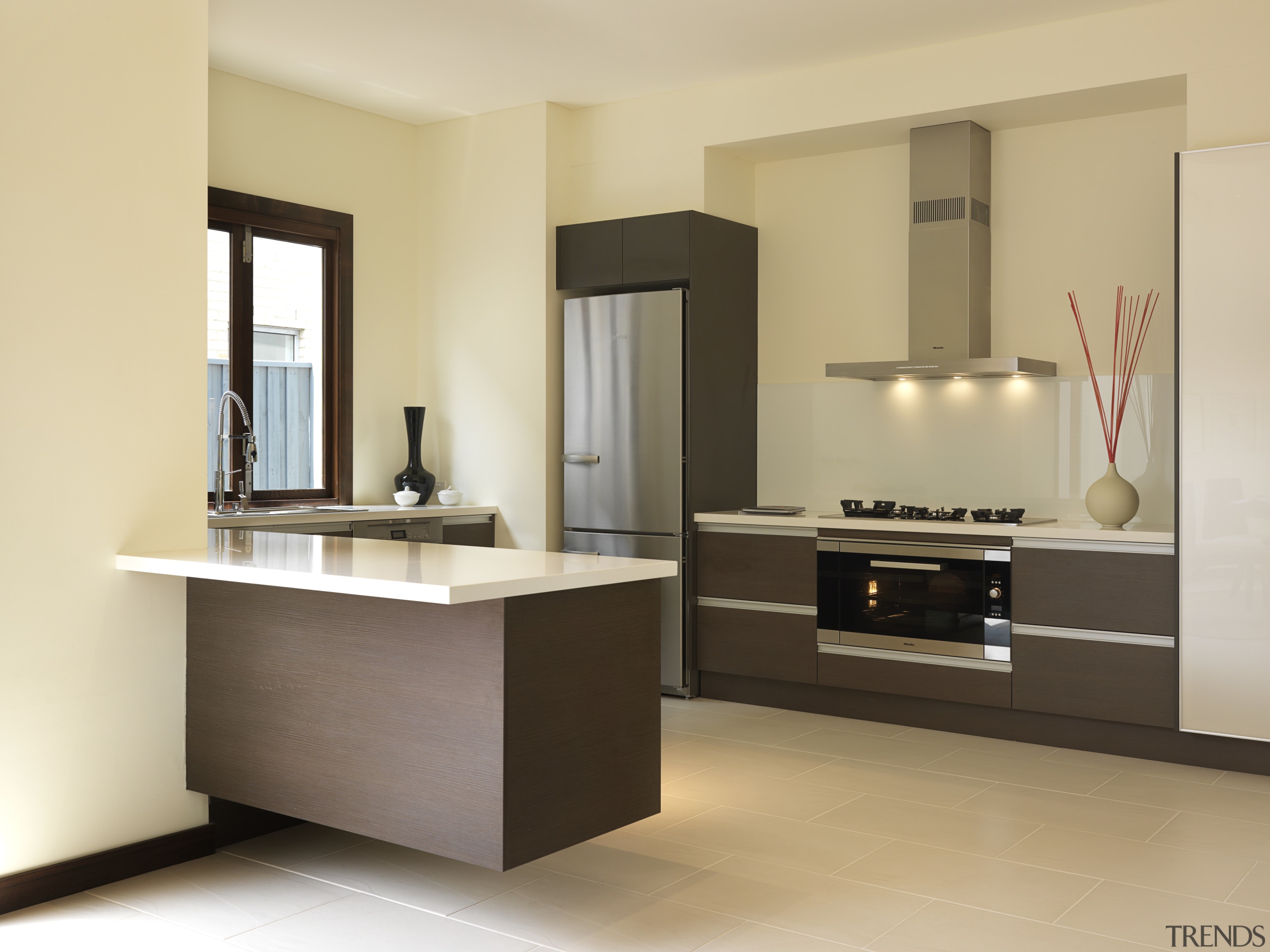 Rather than specifying standard 60cm cooking appliances, the cabinetry, countertop, floor, furniture, interior design, kitchen, product design, room, sink, orange, brown