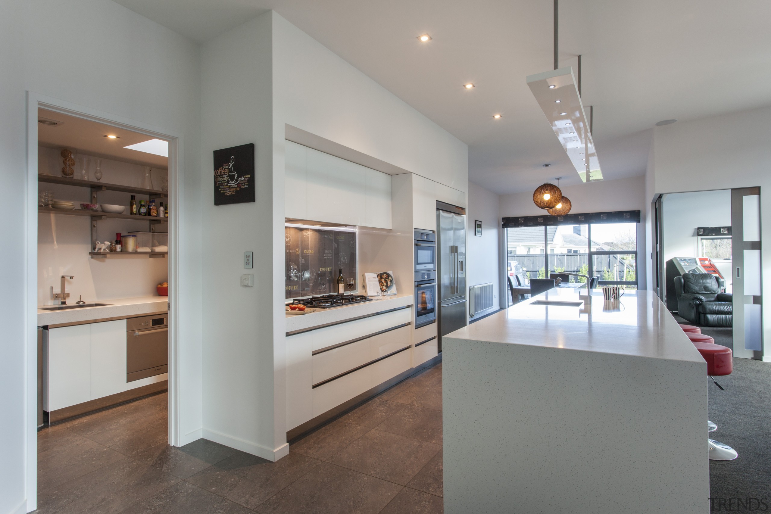 This Mastercraft kitchen features white cabinetry and a interior design, kitchen, real estate, gray