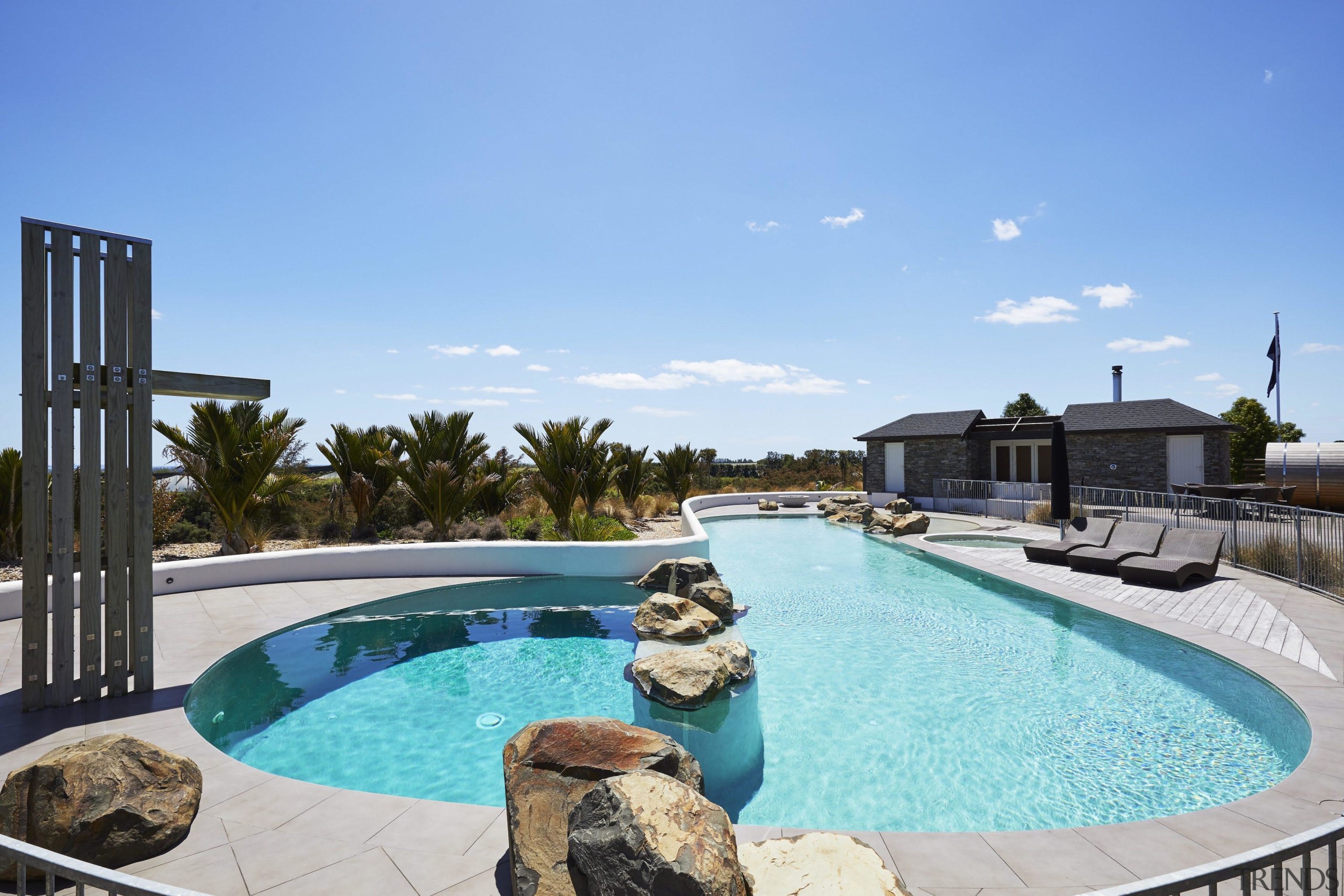 The pool has an organic feel with rocks 