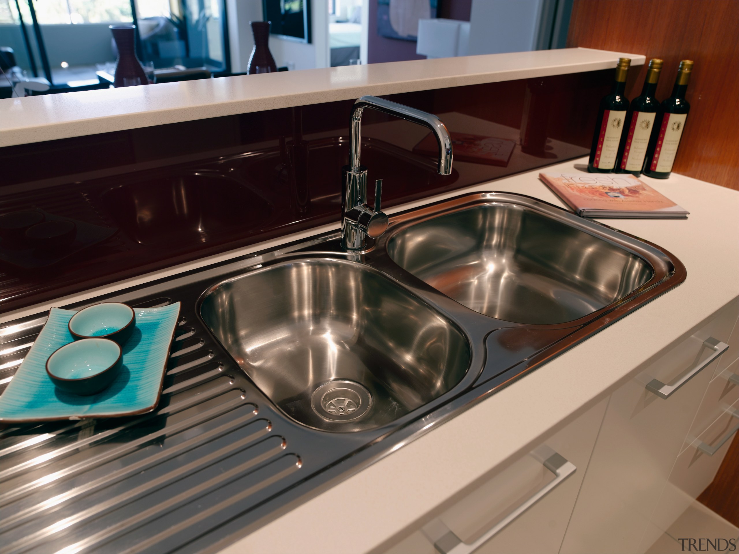 A view of the hydraulic system that A countertop, kitchen, plumbing fixture, sink, black