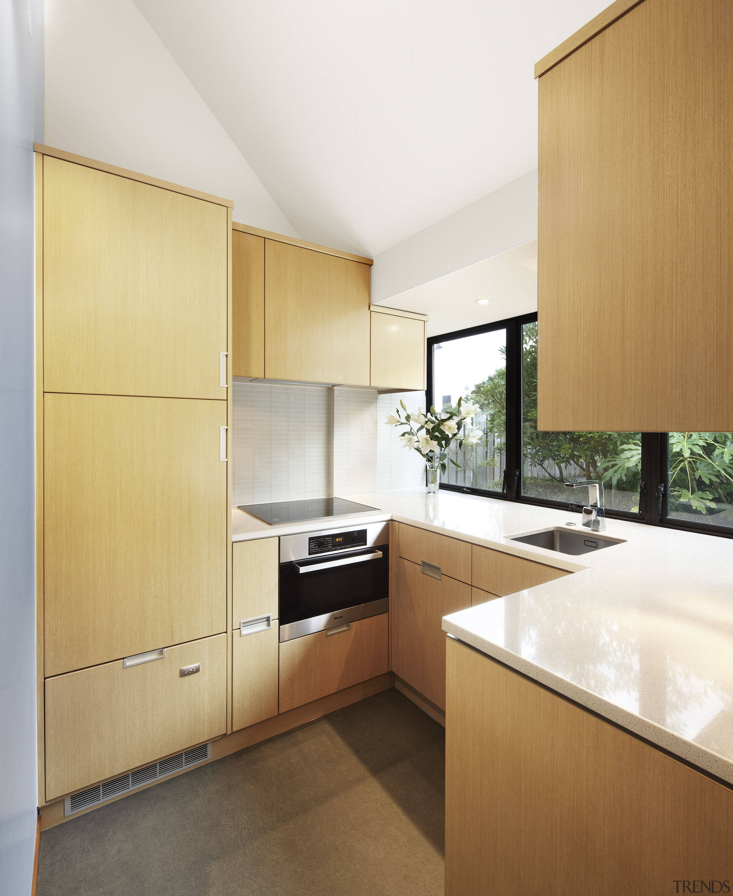 View of a kitchen designed by Ingrid Geldof cabinetry, countertop, interior design, kitchen, property, real estate, orange, white