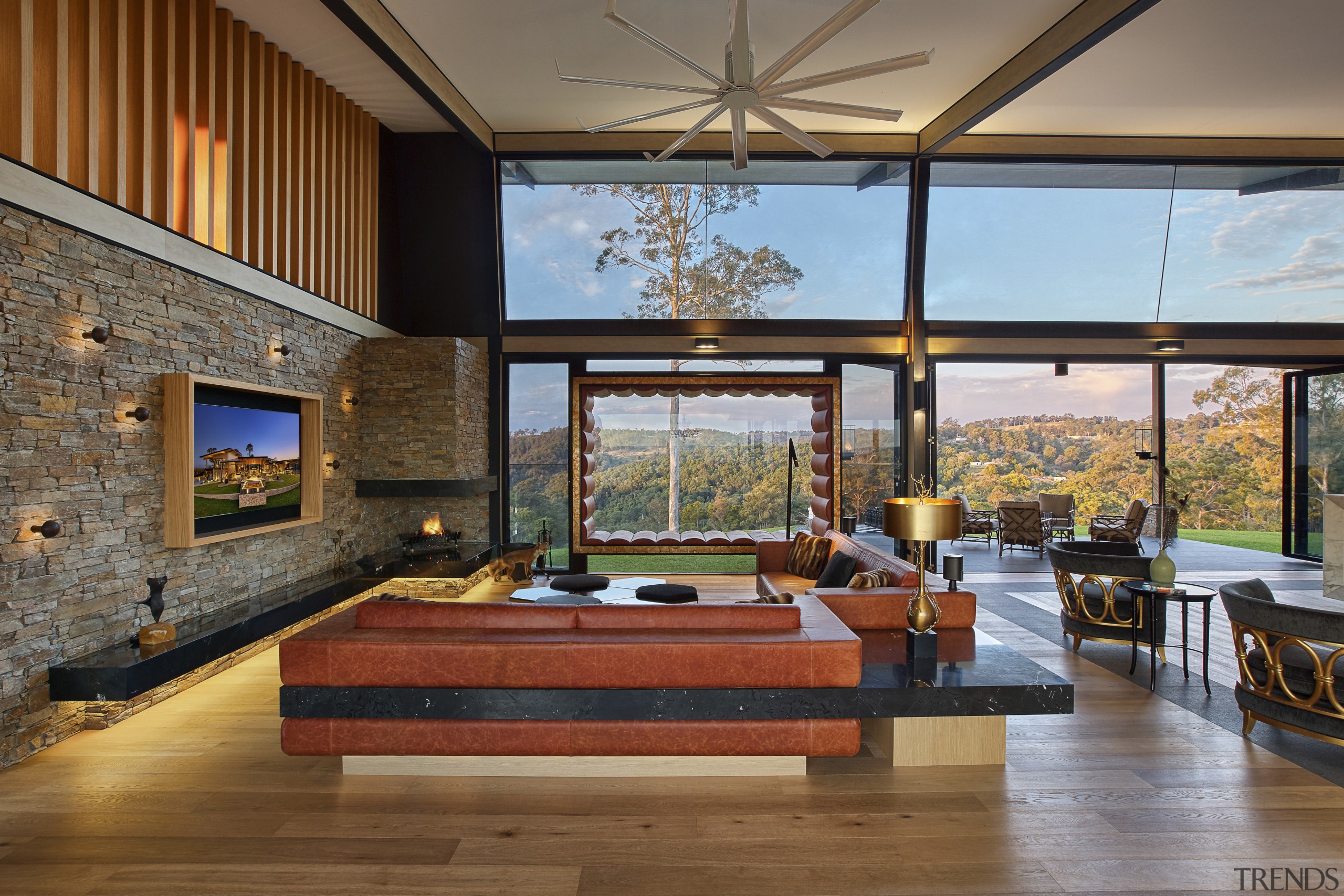 In this luxury lodge, rustic cladding finishes such architecture, ceiling, daylighting, estate, house, interior design, living room, real estate, brown