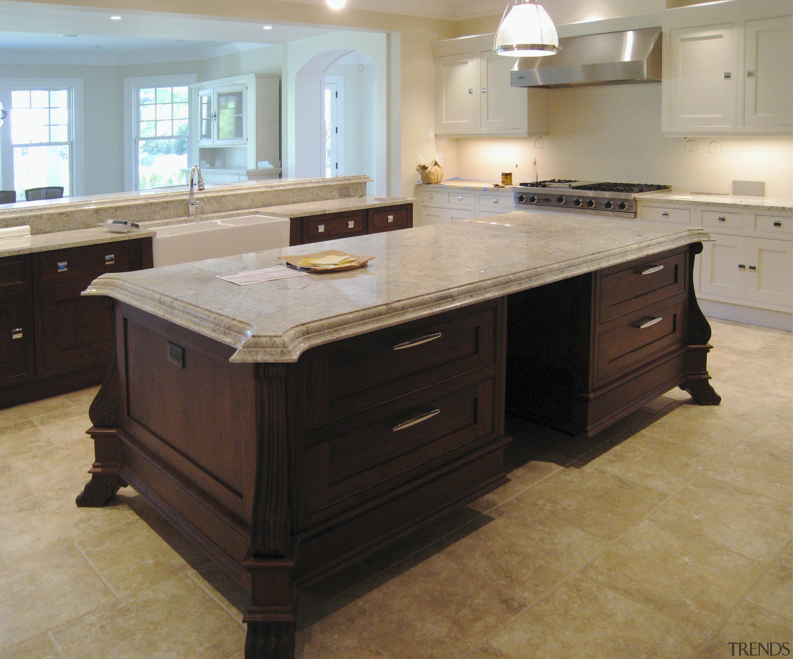 Image of a kitchen from Clive Christian which cabinetry, countertop, cuisine classique, floor, flooring, furniture, hardwood, kitchen, room, tile, wood flooring, wood stain, gray, black