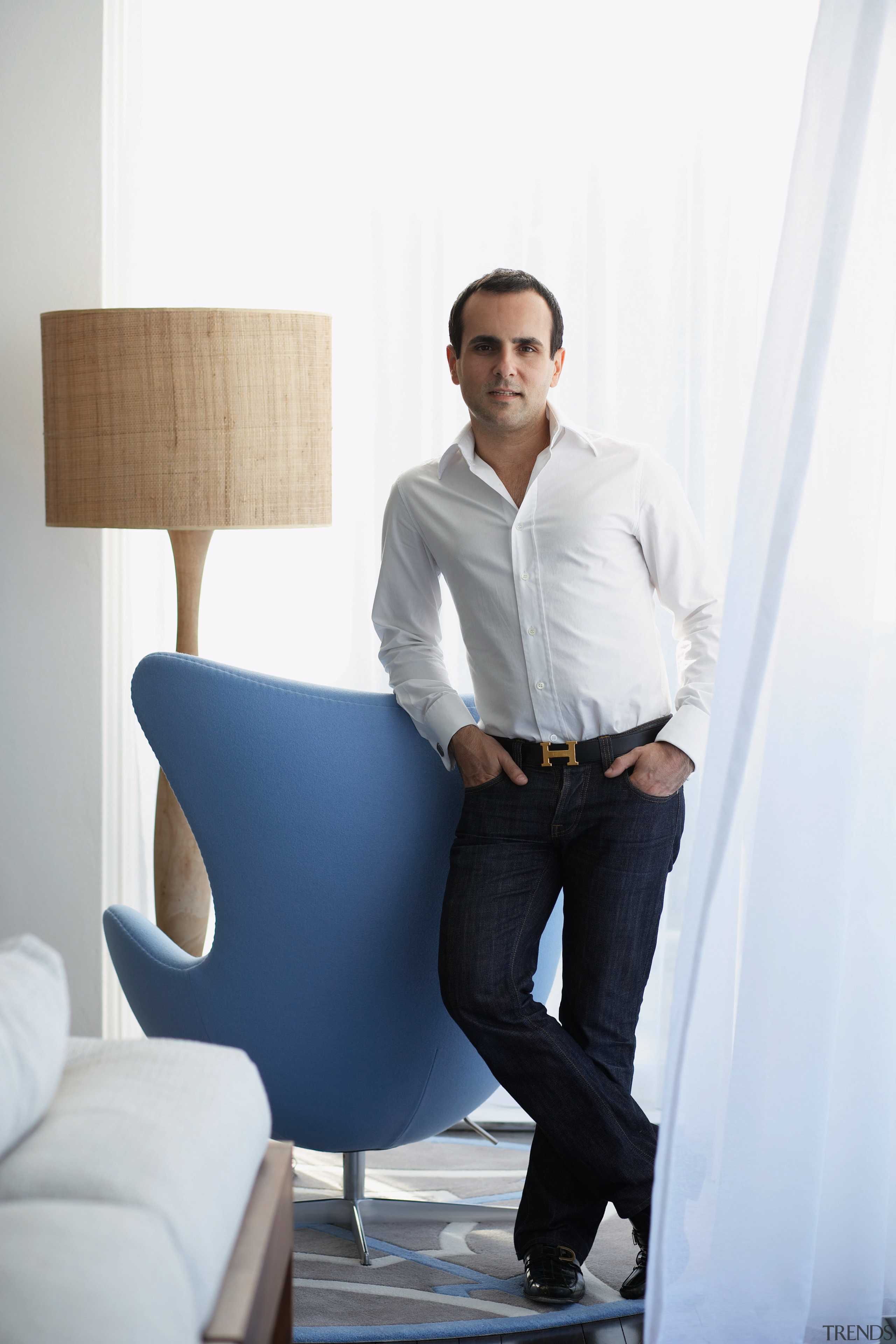 Interior designer Greg Natale of Greg Natale Design businessperson, chair, furniture, product design, shoulder, sitting, standing, white collar worker, white