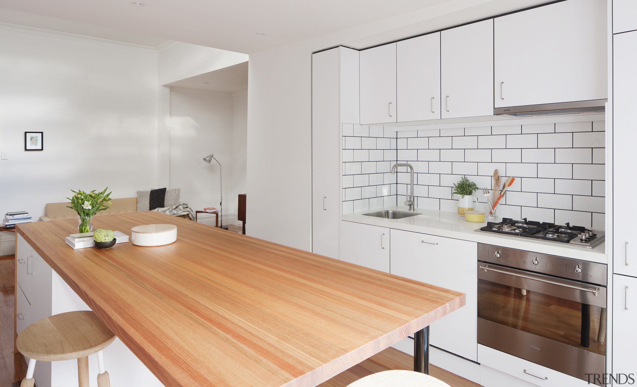 White cabinets, subway tiles and mid-tone timber finishes countertop, cuisine classique, floor, interior design, kitchen, property, real estate, gray