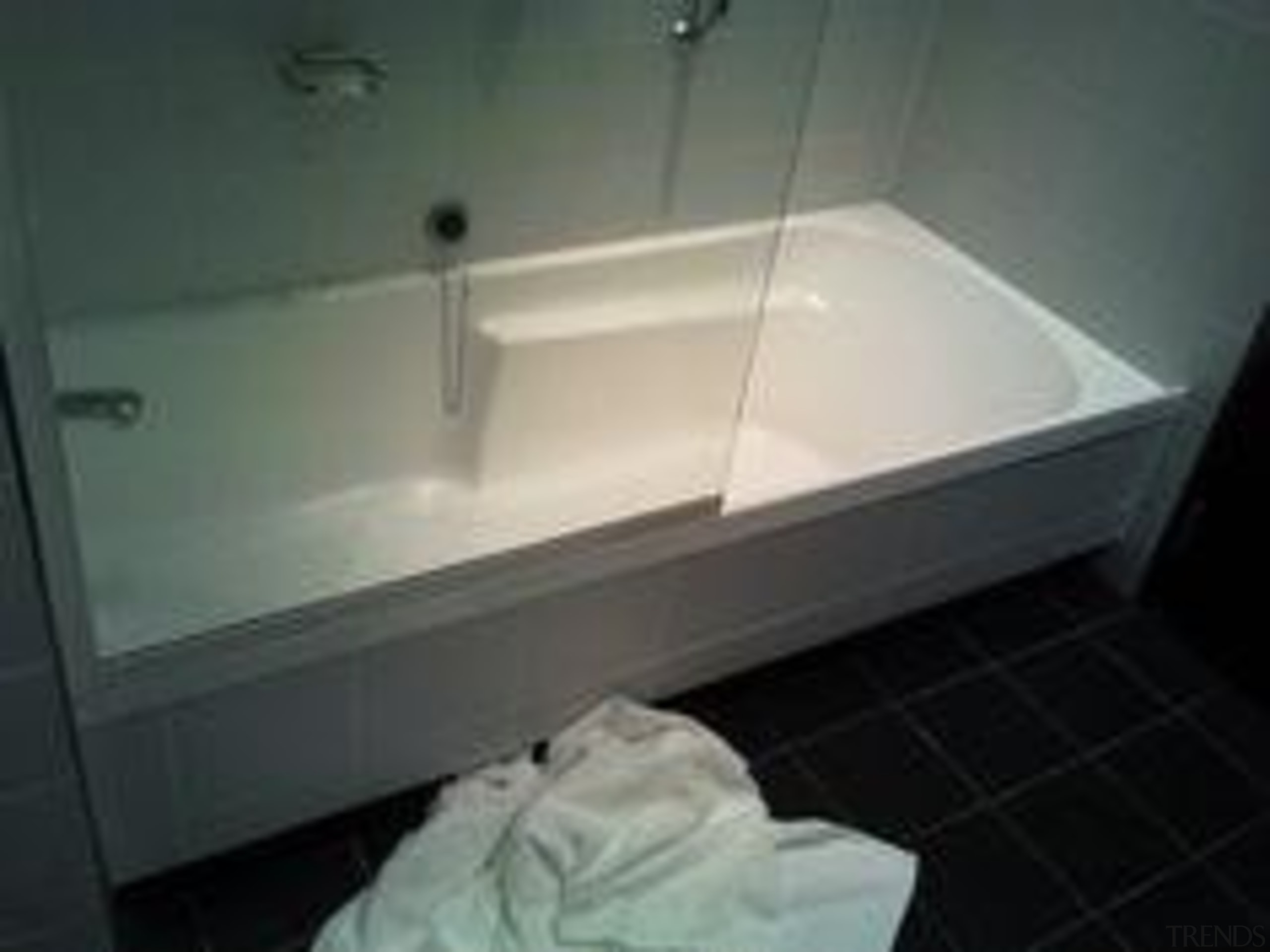 Before the renovation. Standard tiles on wall and bathroom, bathtub, floor, glass, plumbing fixture, product, property, room, sink, gray, black