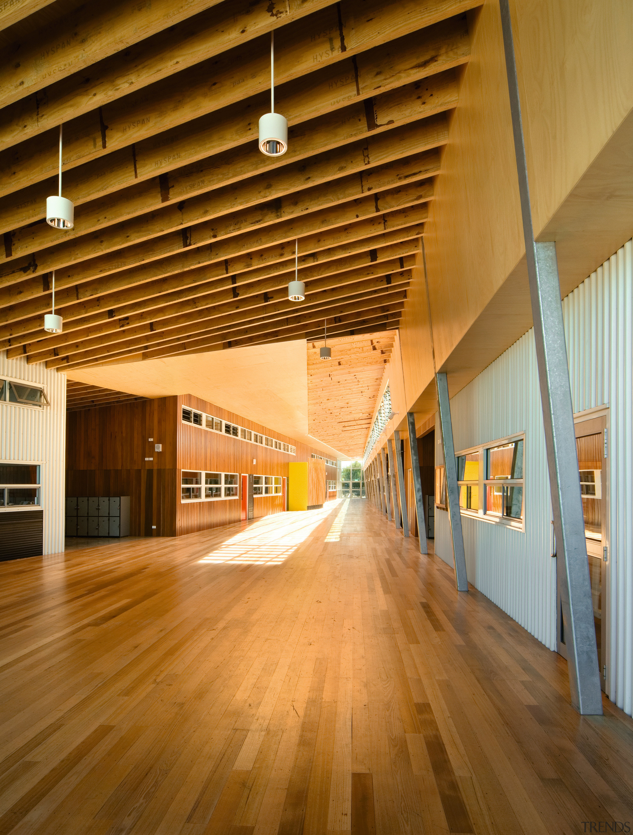 View of Williamstown High School in Melbourne. Designed architecture, ceiling, daylighting, floor, flooring, hardwood, interior design, lobby, structure, wood, wood flooring, brown, orange