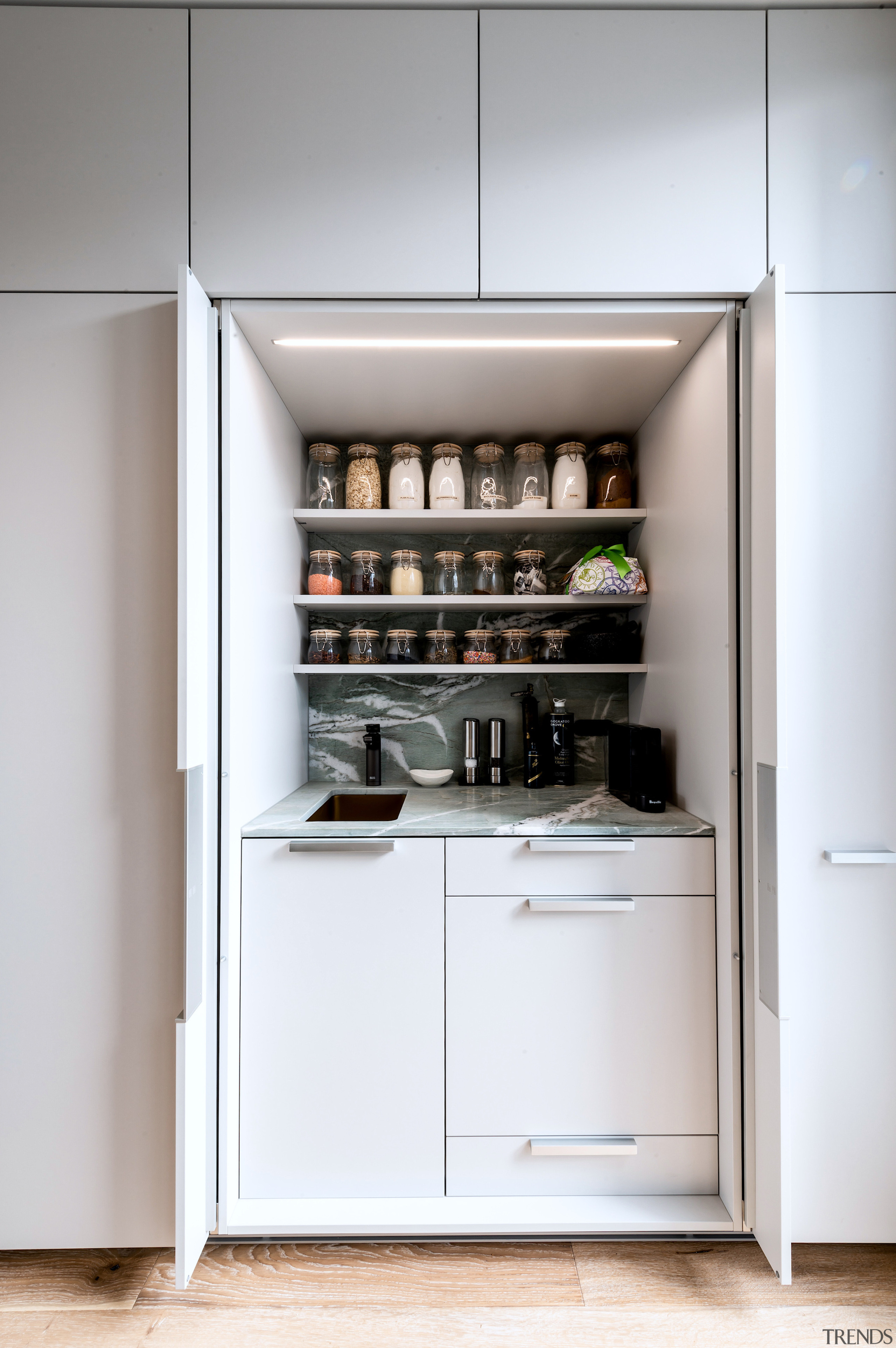 Pantry work area with tuck away doors. - 