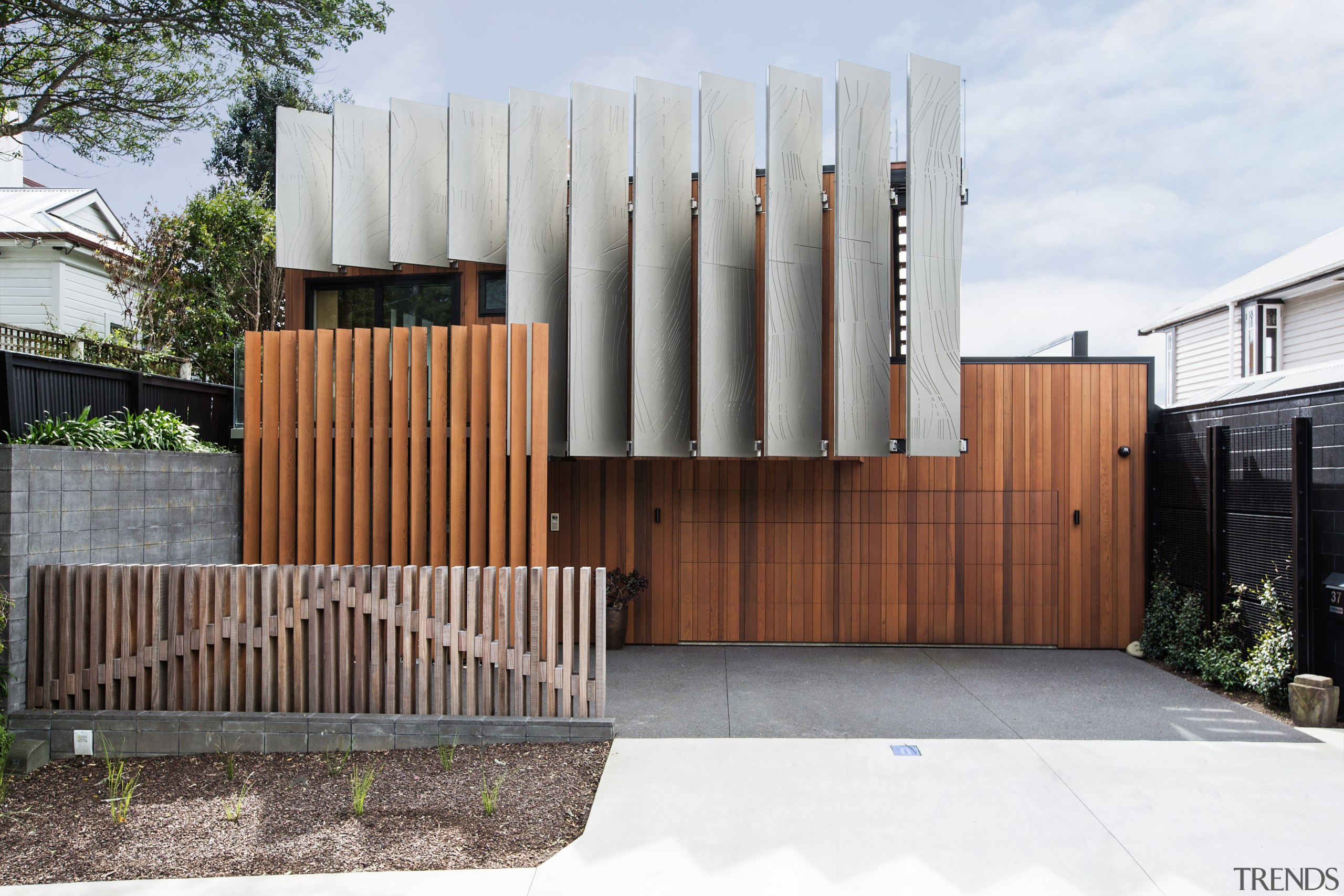 ​​​​​​​A fence depicting Mt Taranaki provides an excellent architecture, facade, house, home, Boon Team Architects, privacy