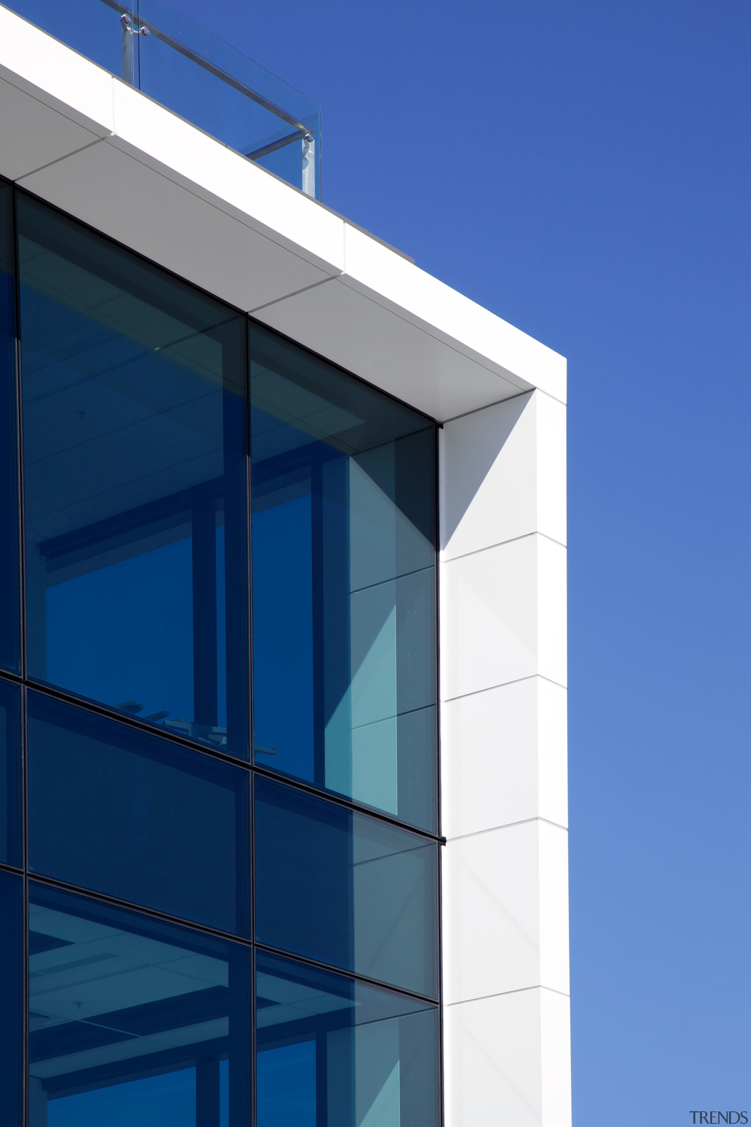 Watercare House in Newmarket boasts a strong street architecture, building, commercial building, corporate headquarters, daylighting, daytime, elevation, facade, glass, line, sky, window, blue