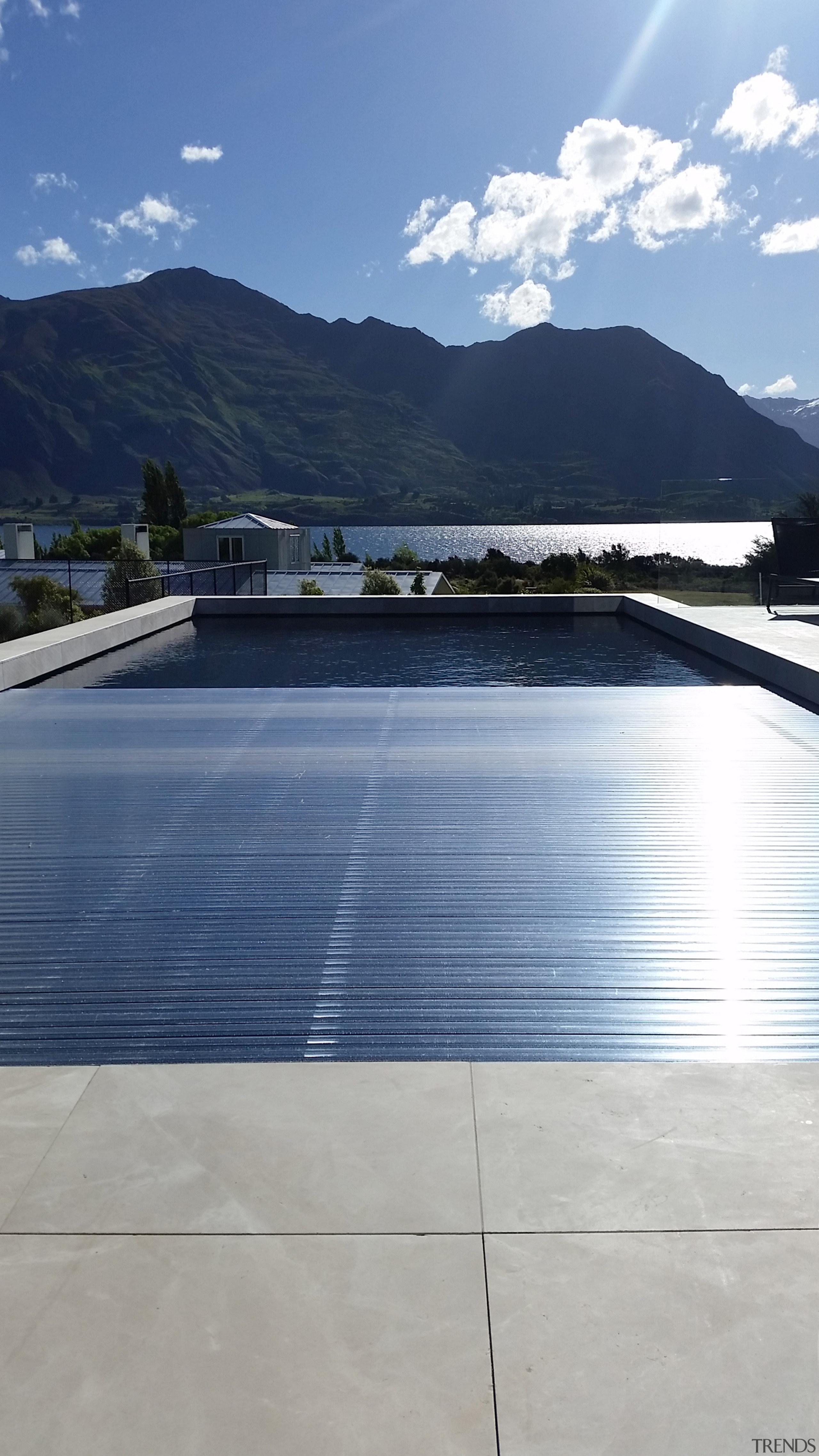 ​​​​​​​Covers 4 Pools has many automated options with architecture, daylighting, lake, line, mountain, reflection, roof, sky, sunlight, technology, blue, gray