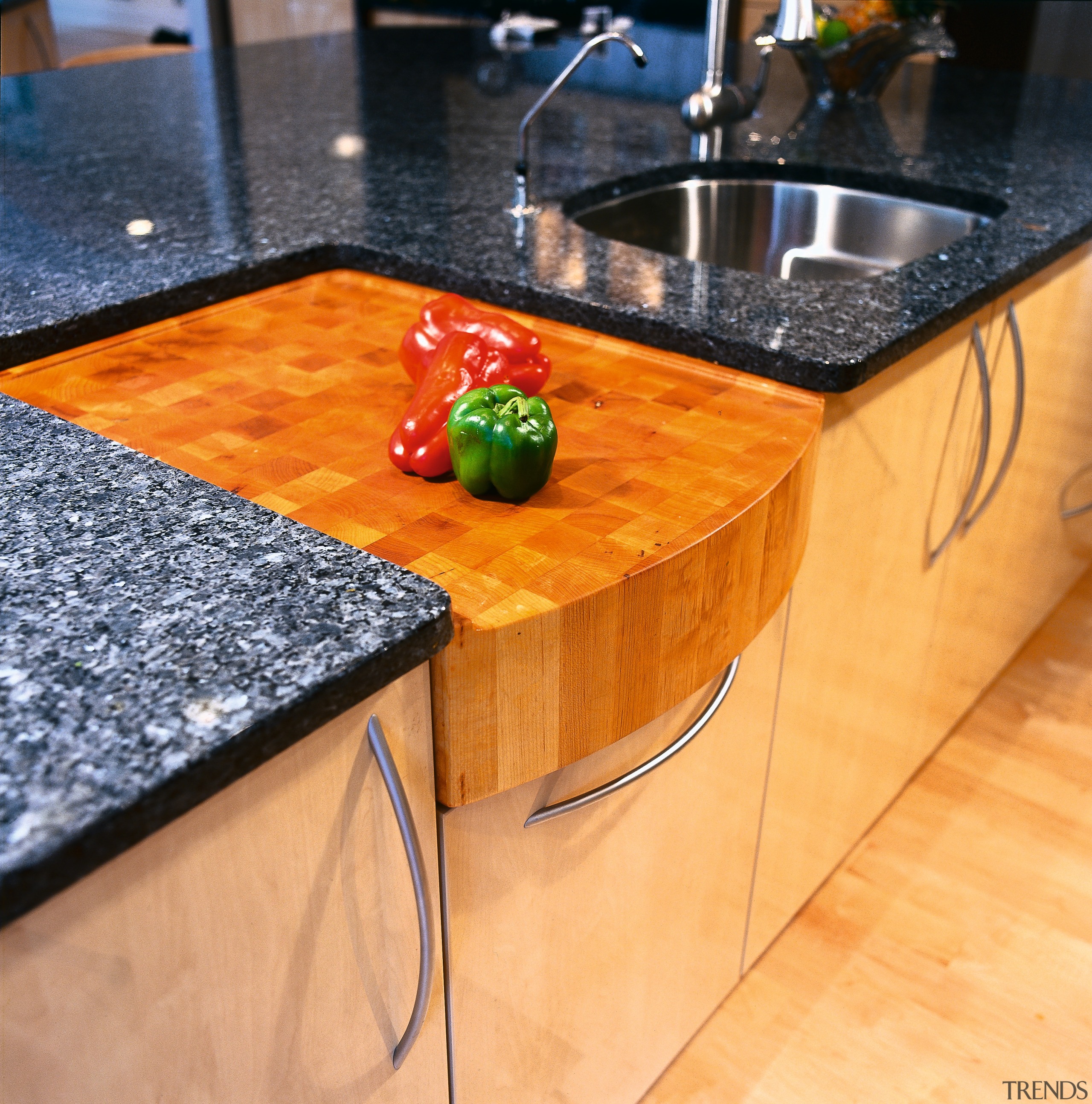 Close view of the built-in chopping board - countertop, floor, flooring, furniture, hardwood, material, table, wood, wood stain, orange